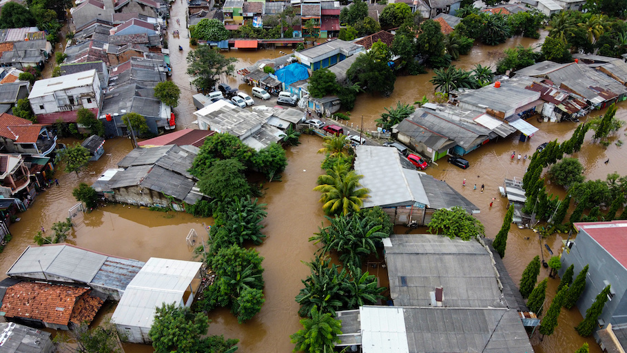 Aerial view of flooding and devastation wrought after massive natural disasters.