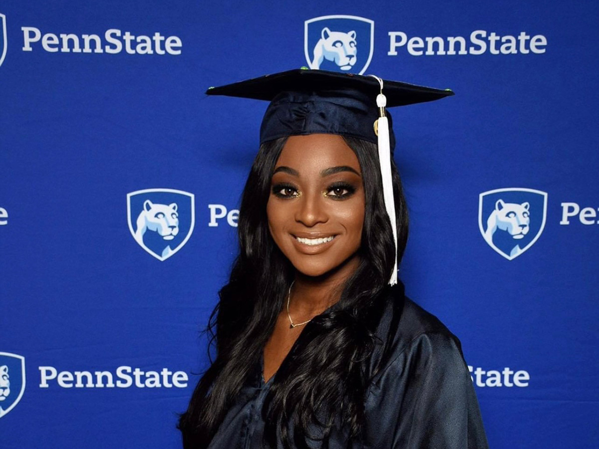 Liberal Arts alumna Khadesia (Keke) Walker poses for a photo wearing her cap and gown at commencement.