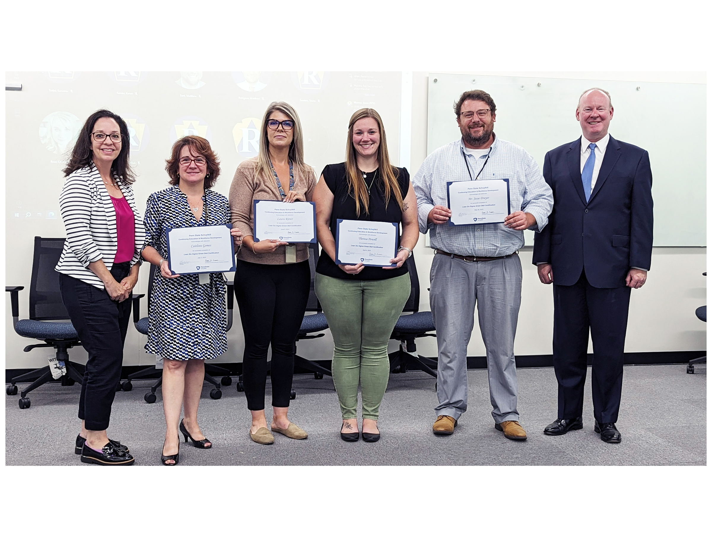 Group of employees from Pa. Dept. of Revenue receiving their Green Belt certifications after completing Lean Six Sigma programming.