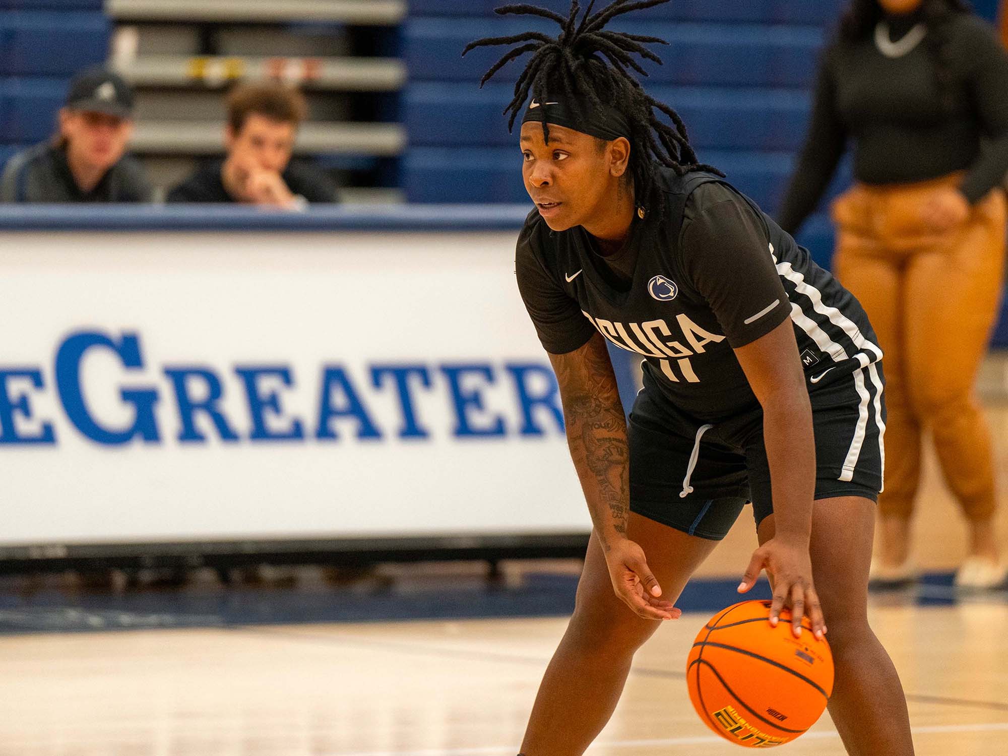 An athlete dribbling a basketball.