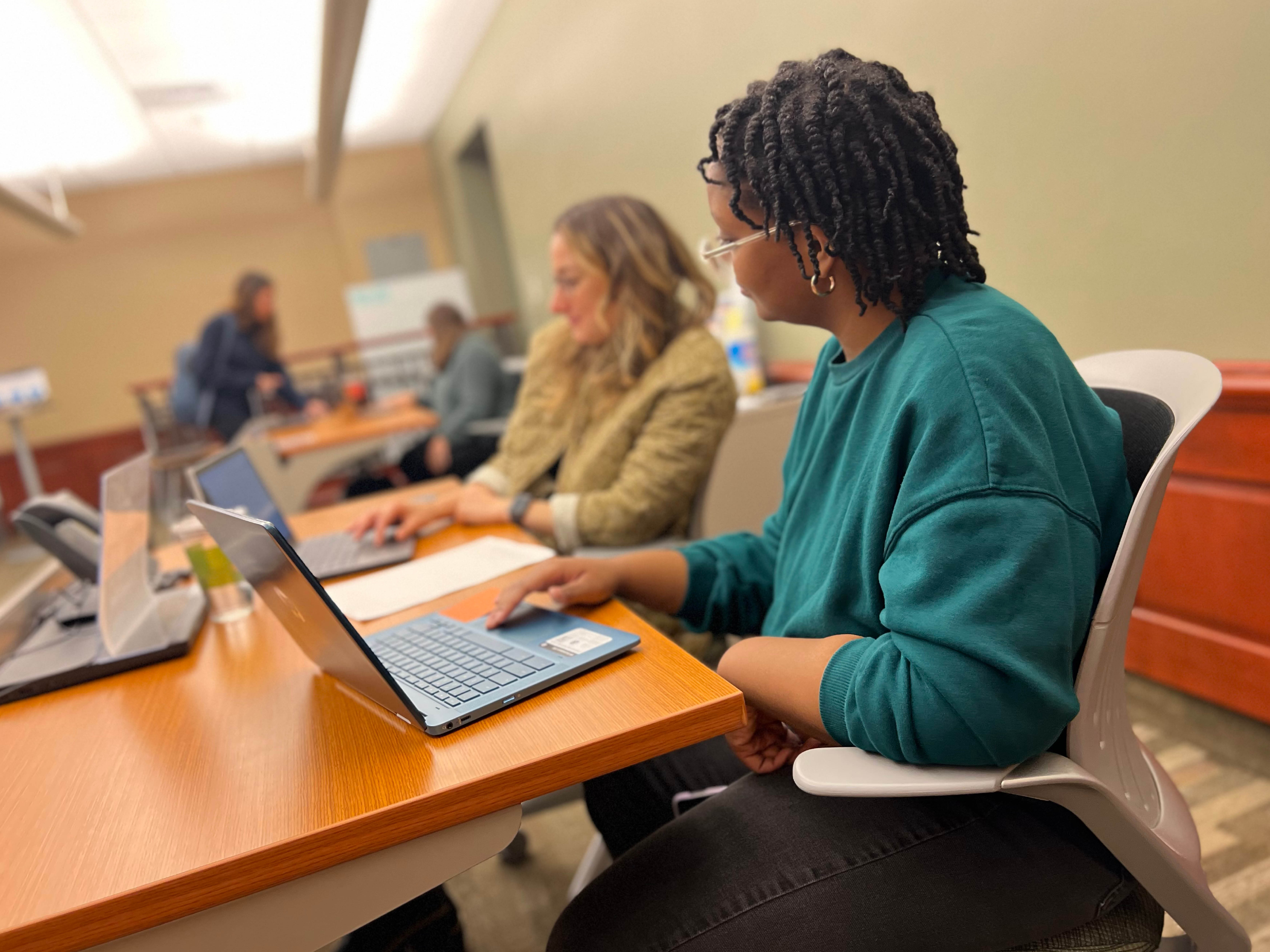 Student in Search Bar working at computer