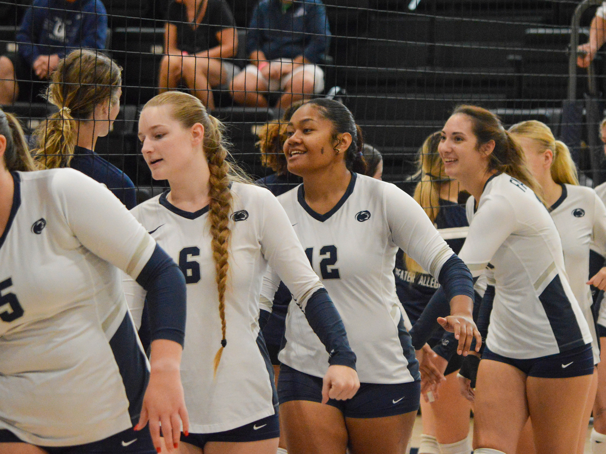 Women's volleyball players on the court