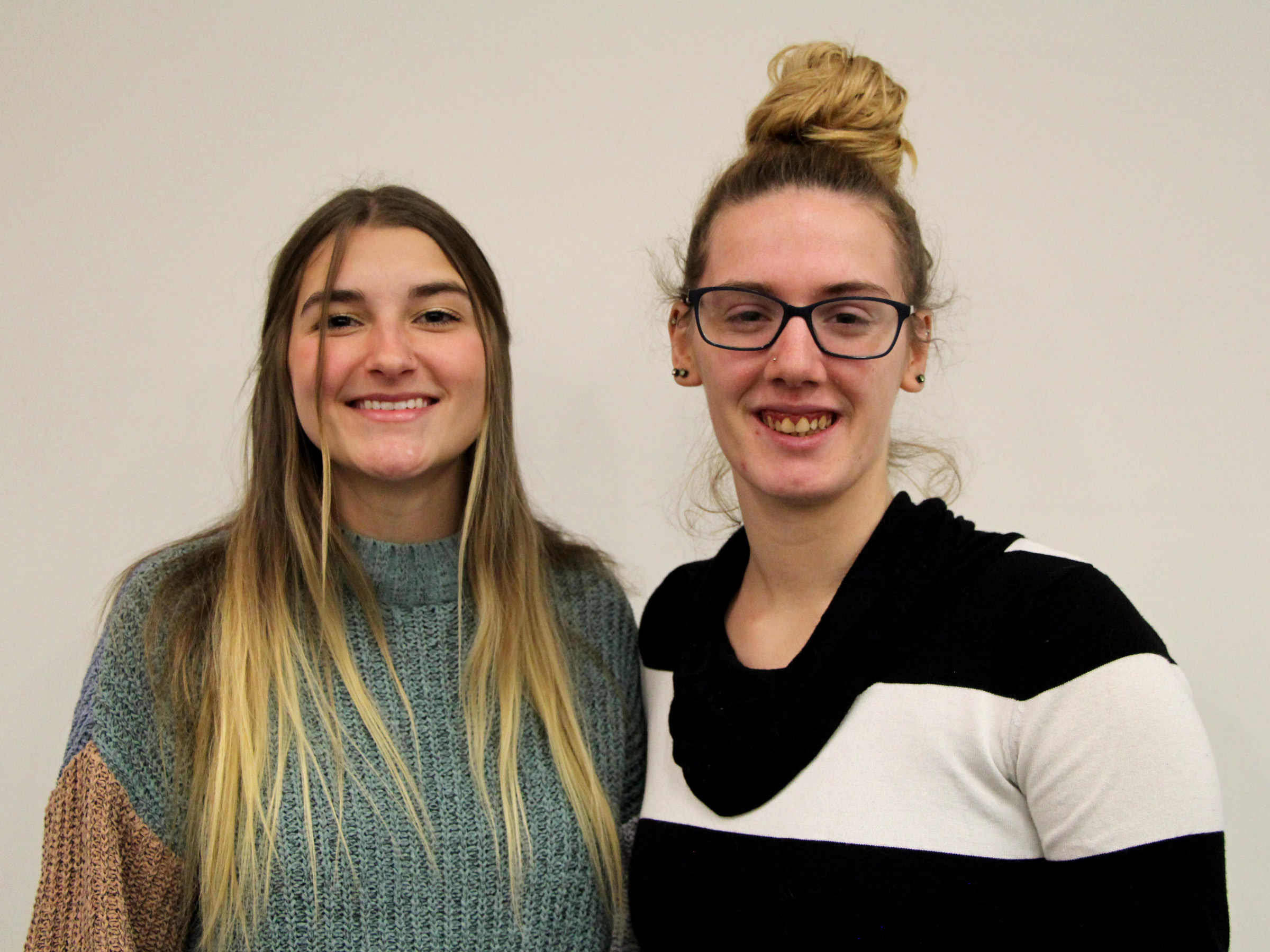 Penn State DuBois students Lilia Lion, left, and Cierra Hoffman, right, at the conclusion of their victimology presentations in Hiller Auditorium.