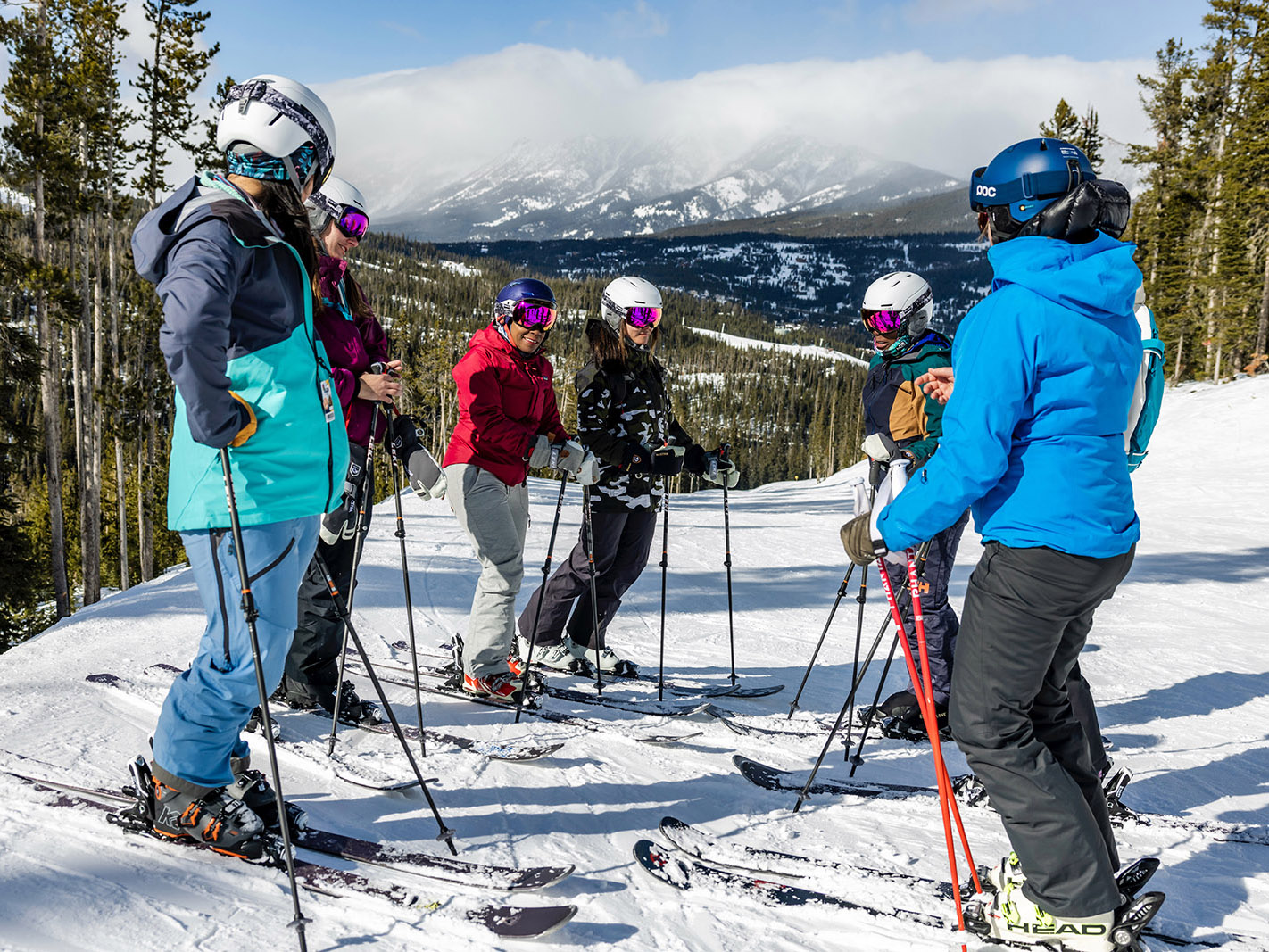 Group of skiers standing outside in the snow