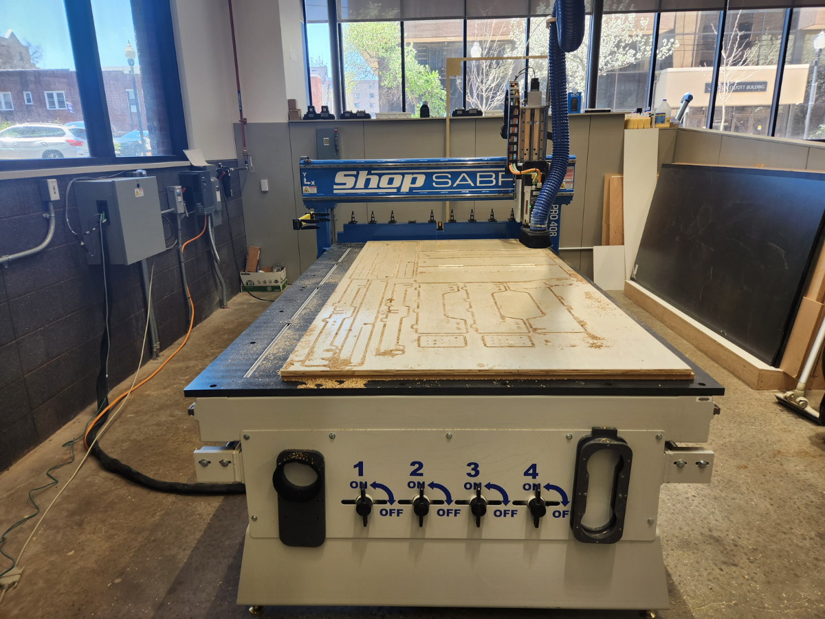 A CNC router cutting out a sleeping platform prototype