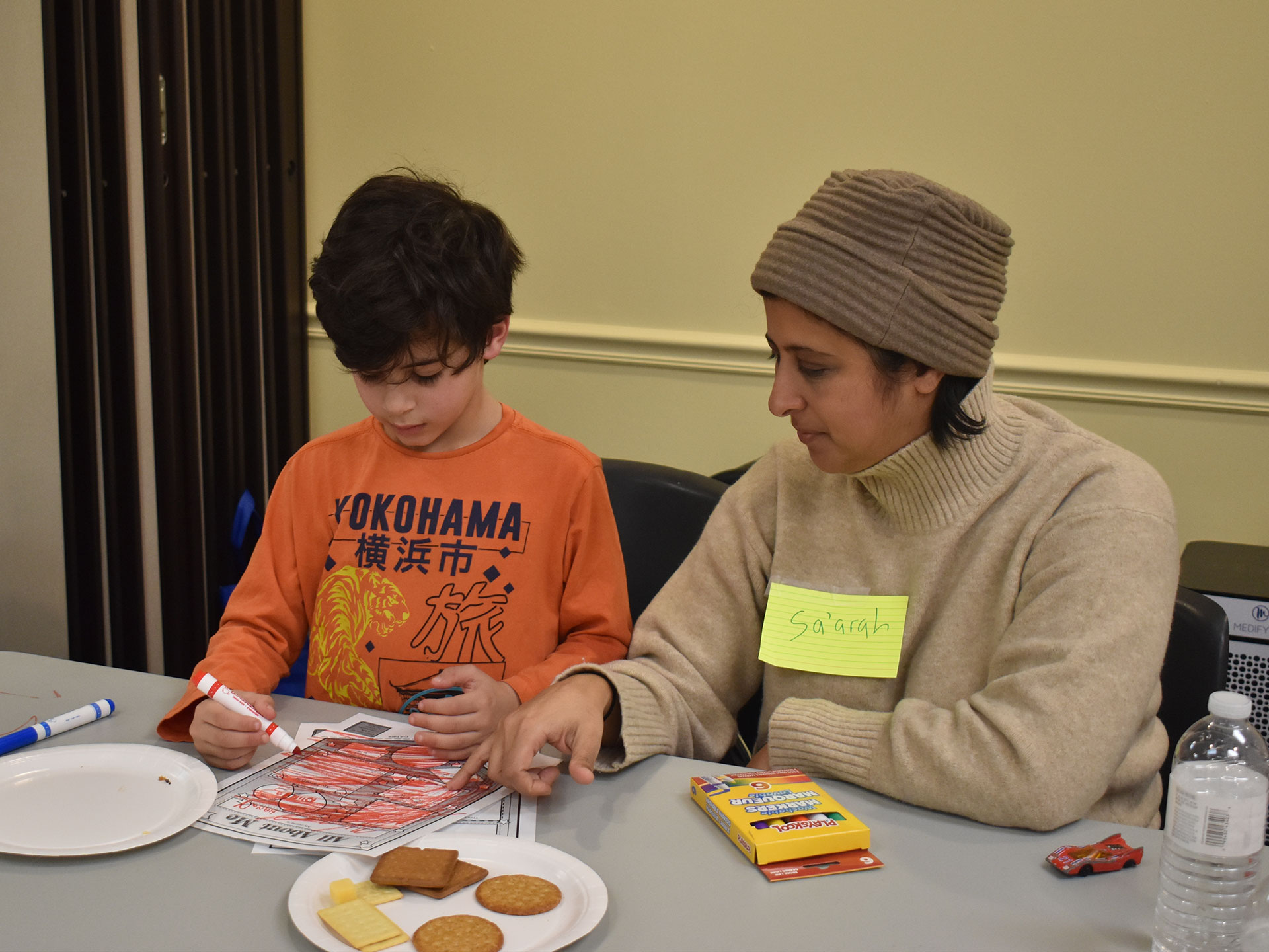 Parent and child completing worksheets