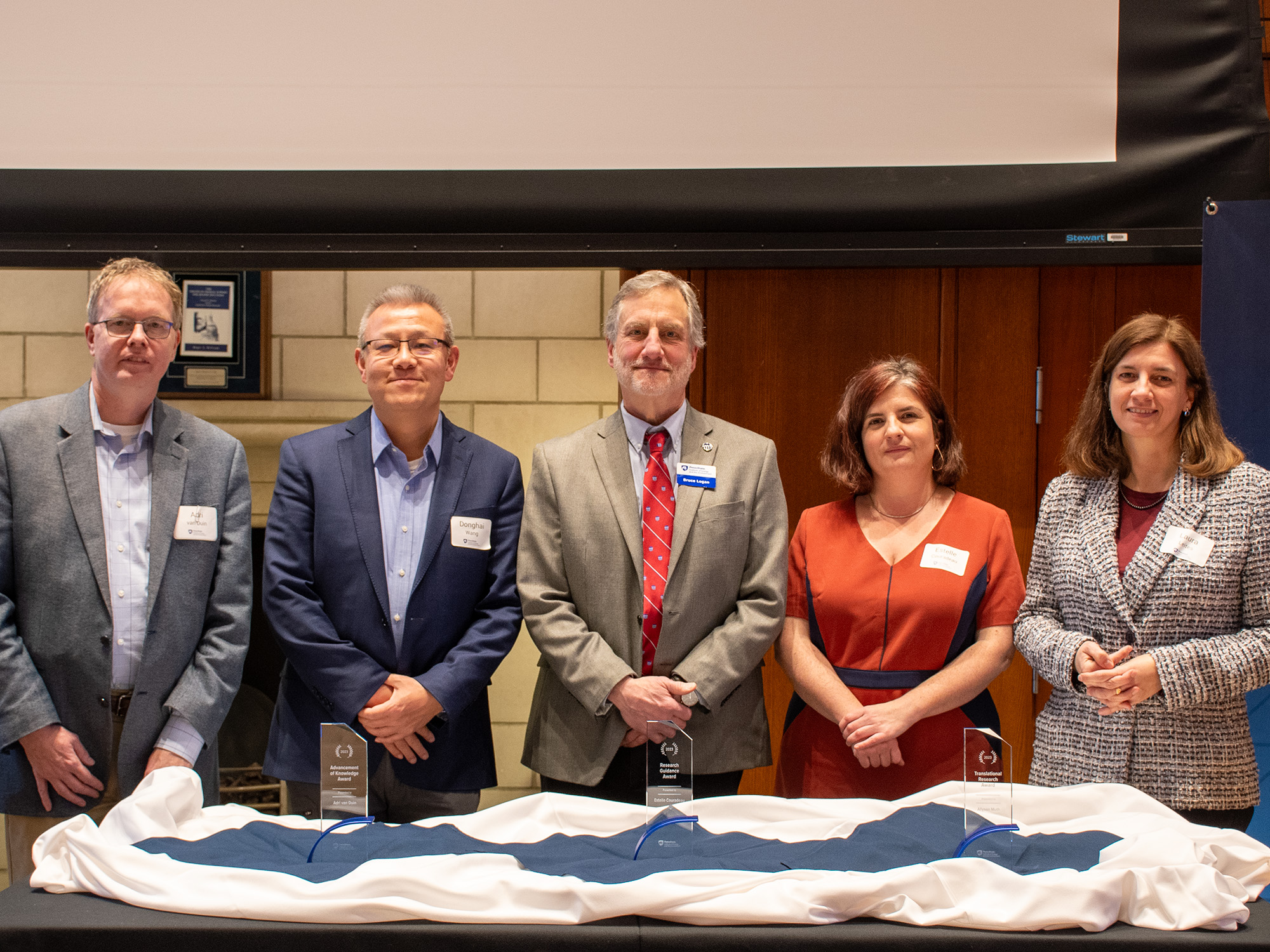 Bruce Logan, center, with four of the IEE Research Award winners.