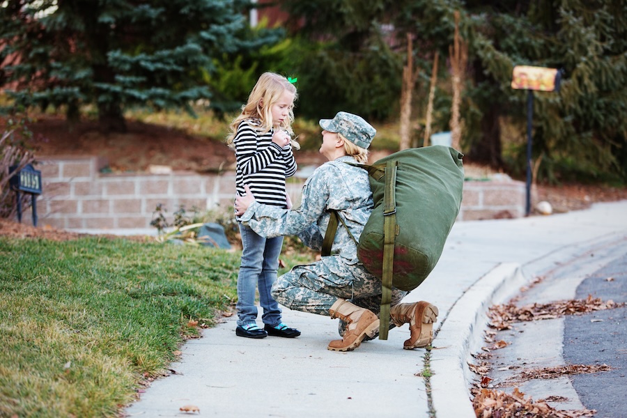 Military mother and daughter greeting each other