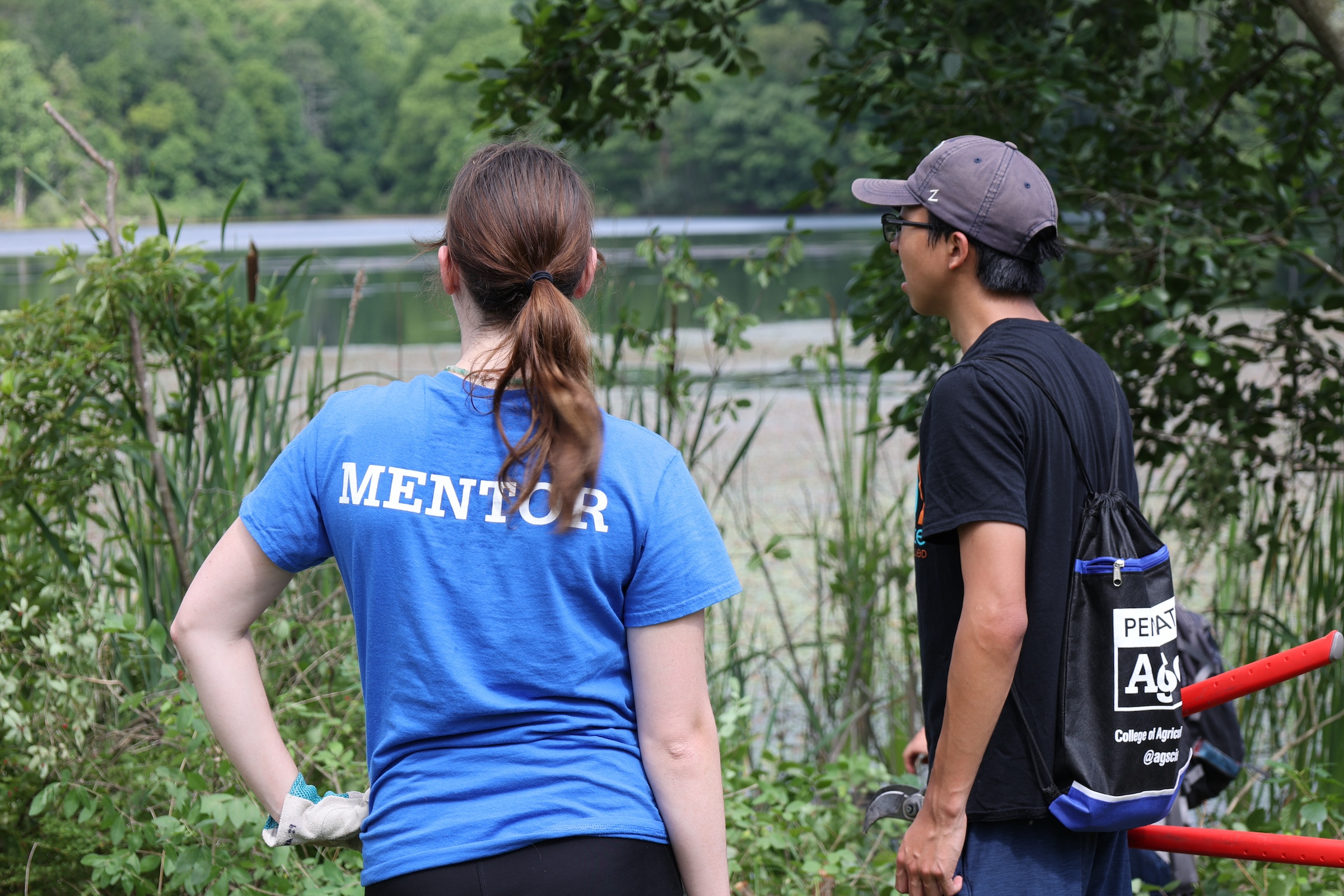 LEAP mentor and student standing together looking at Lake Perez