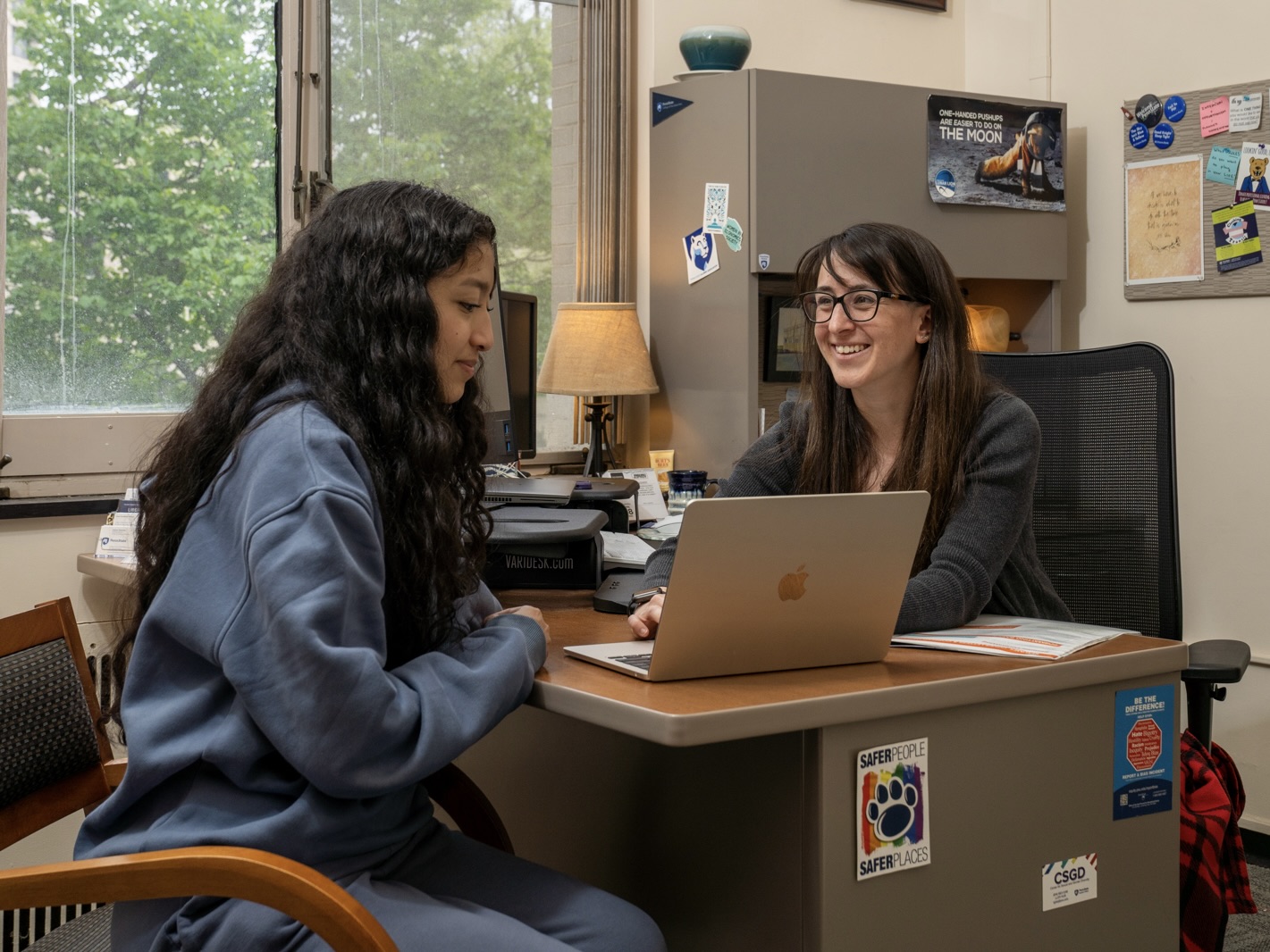 Lauren Granese (right) reviews a Liberal Arts student's resume during a career coaching session in the Career Enrichment Network.