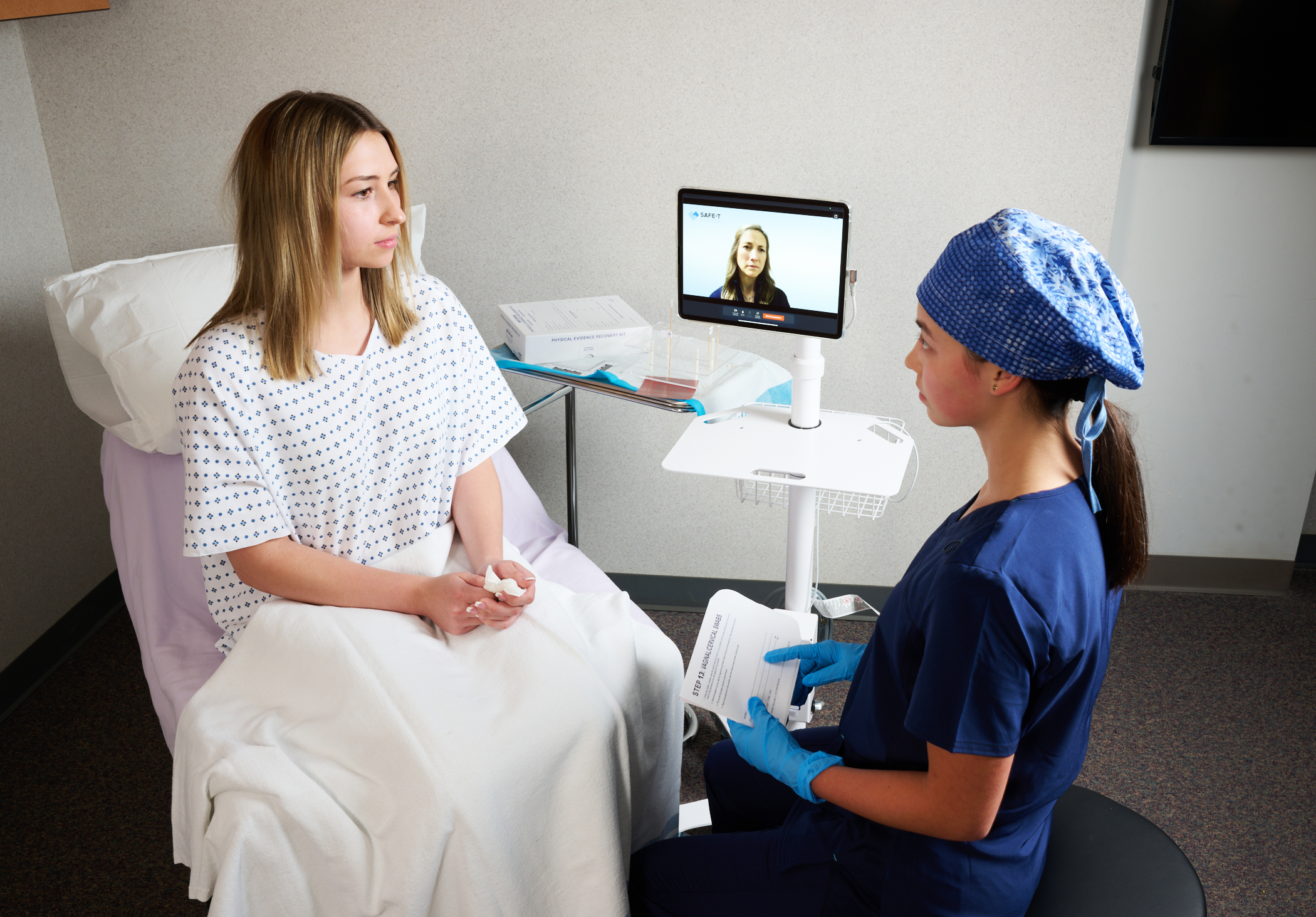 Patient receiving SANE telehealth care.