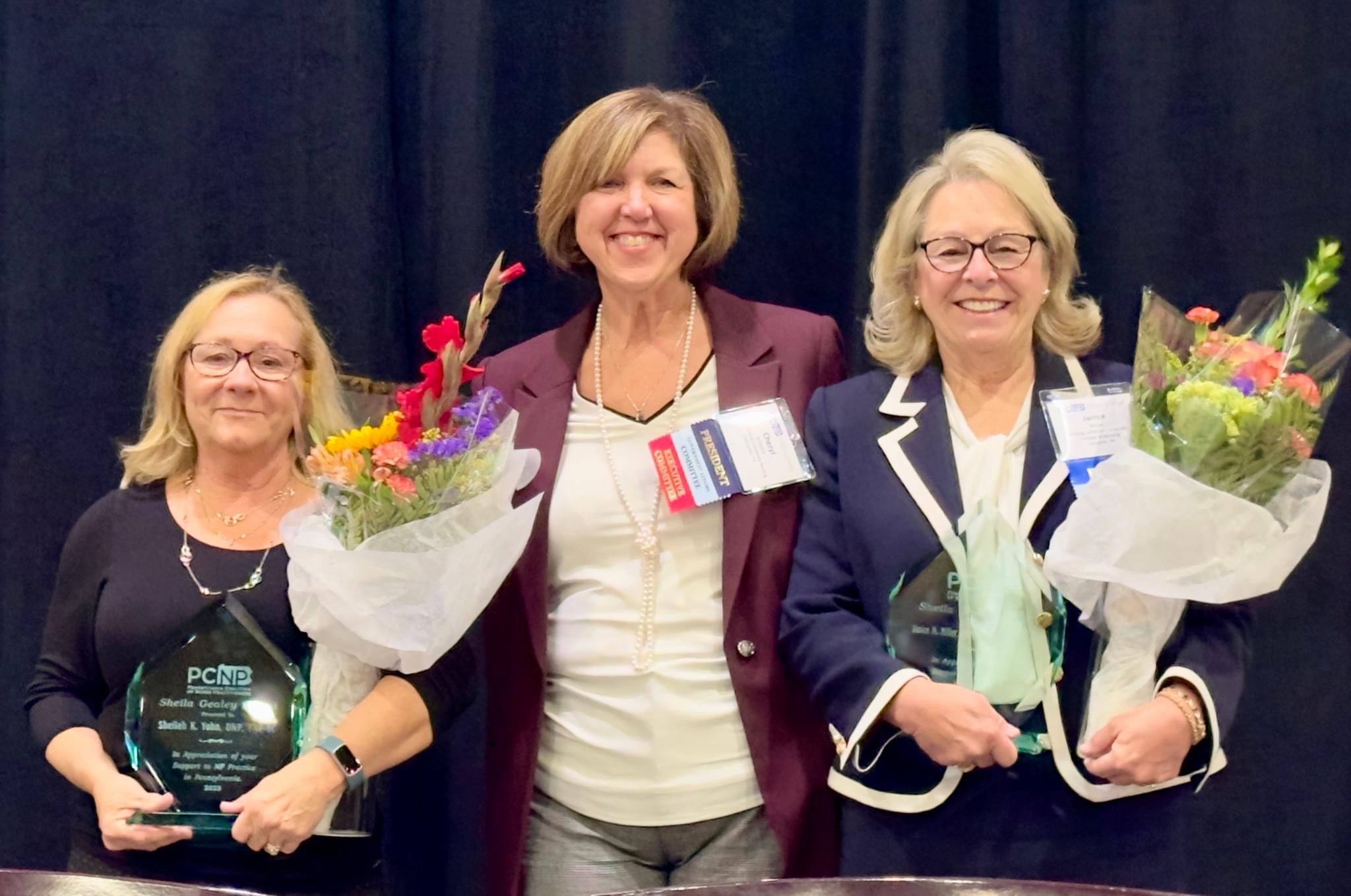 Sheilah Yohn (left) accepting the 2023 Sheila Gealey Award.