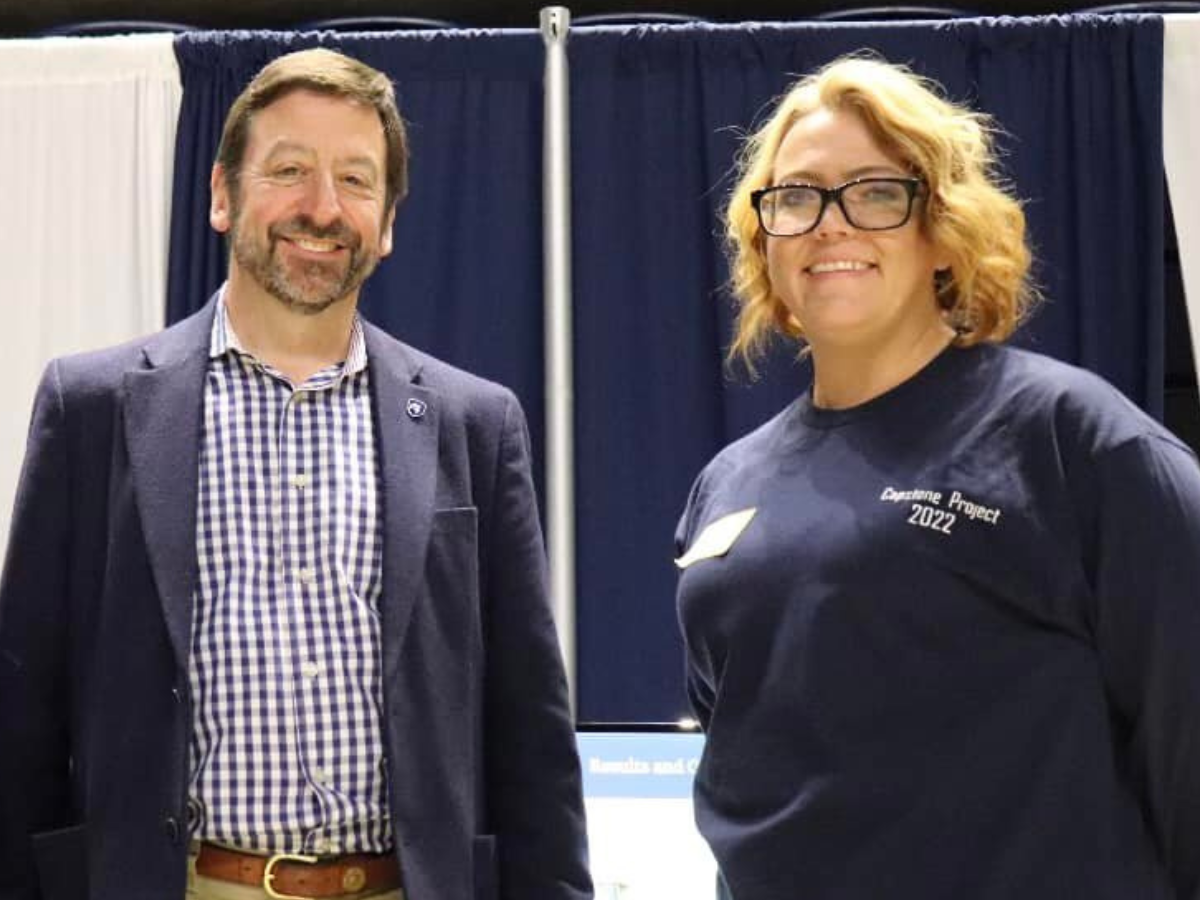 Charlee Murdock (right) poses with William Andahazy at a Learning Factory showcase.