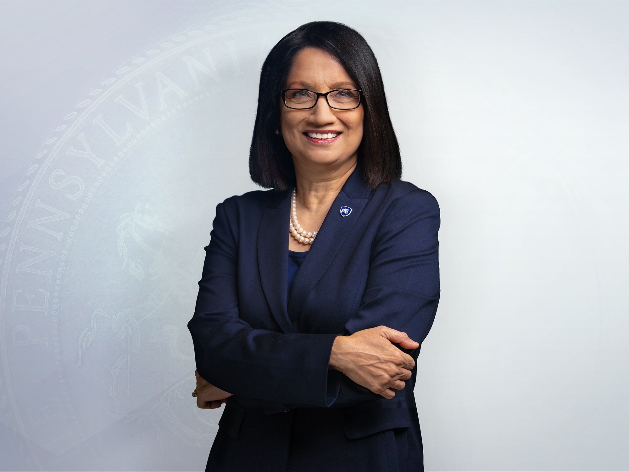 Neeli Bendapudi wearing a dark blue suit with her arms crossed