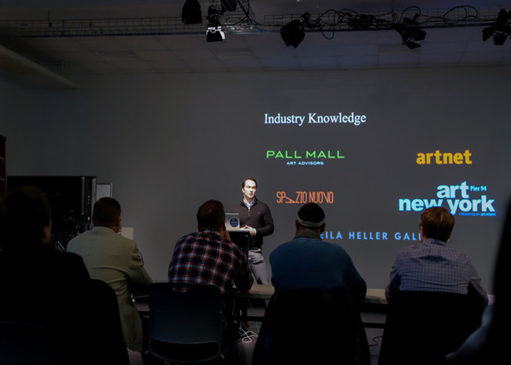 Young man presenting a business pitch to a panel of judges