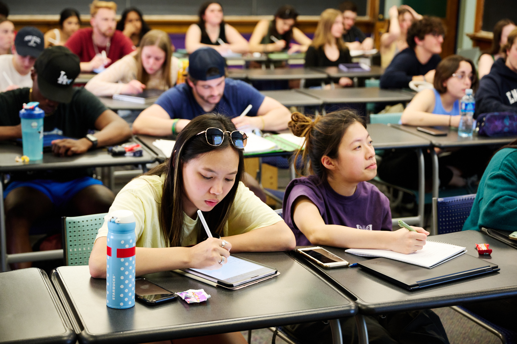 Students sitting at rows of desks attending a guided study group