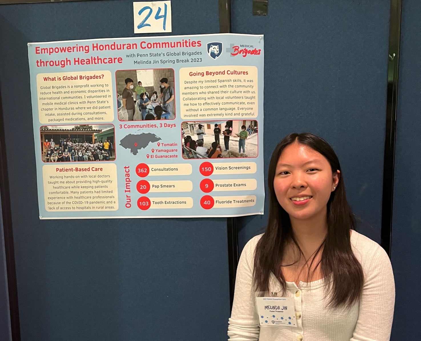 Melinda Jin posing for a photo in front of research poster