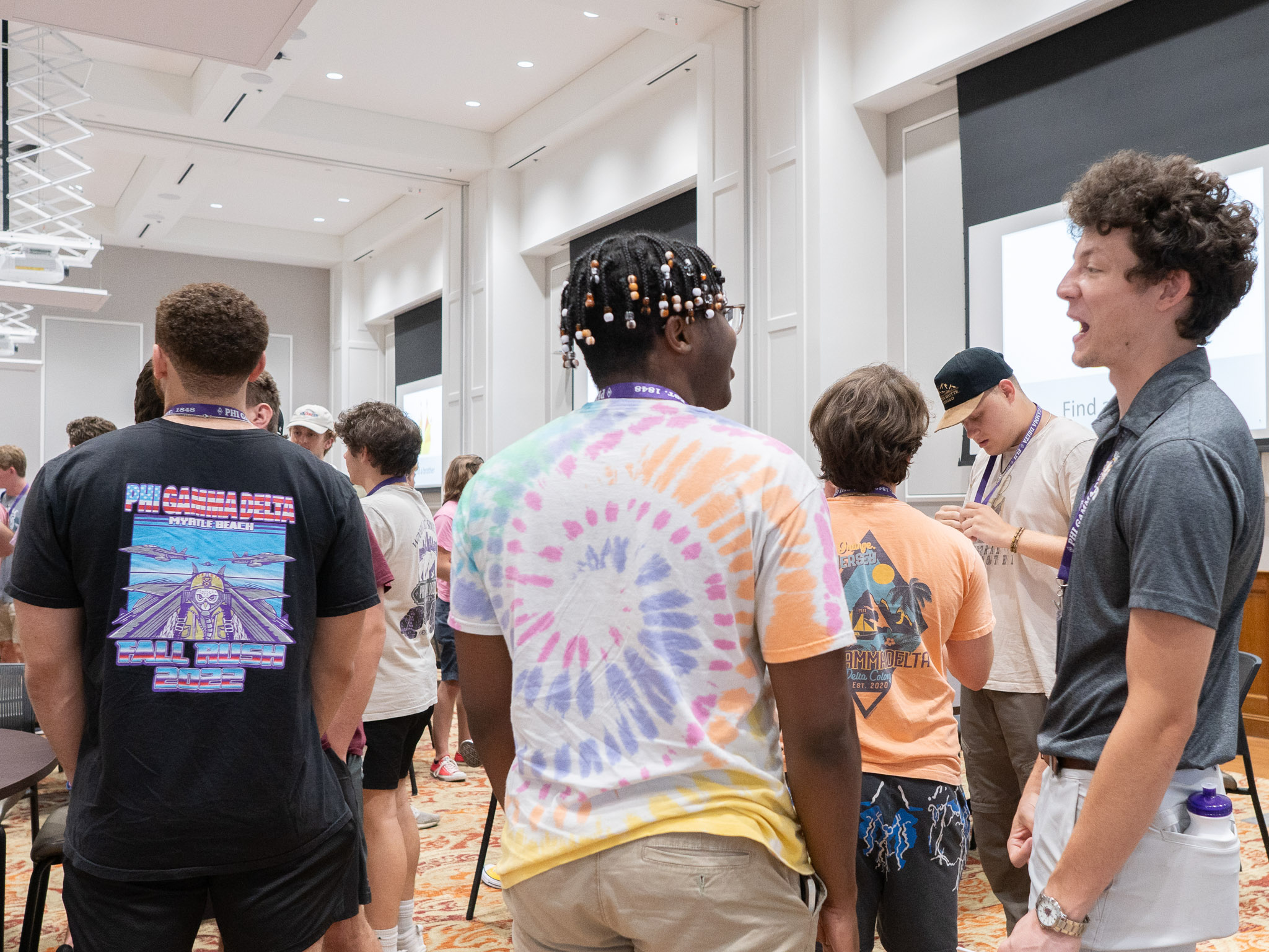 Phi Gamma Delta Fraternity brothers meet and share a laugh