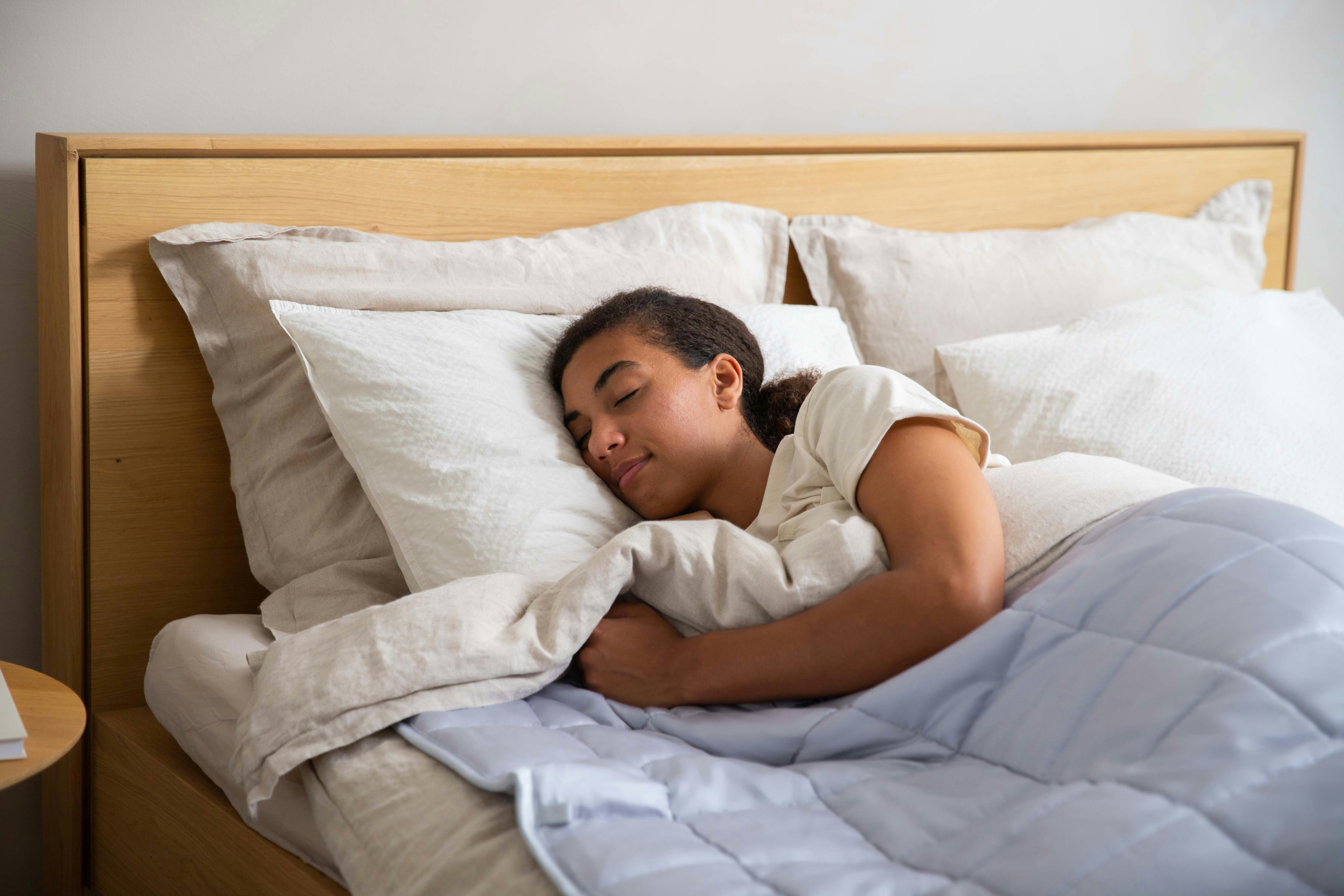 teen girl sleeping in bed