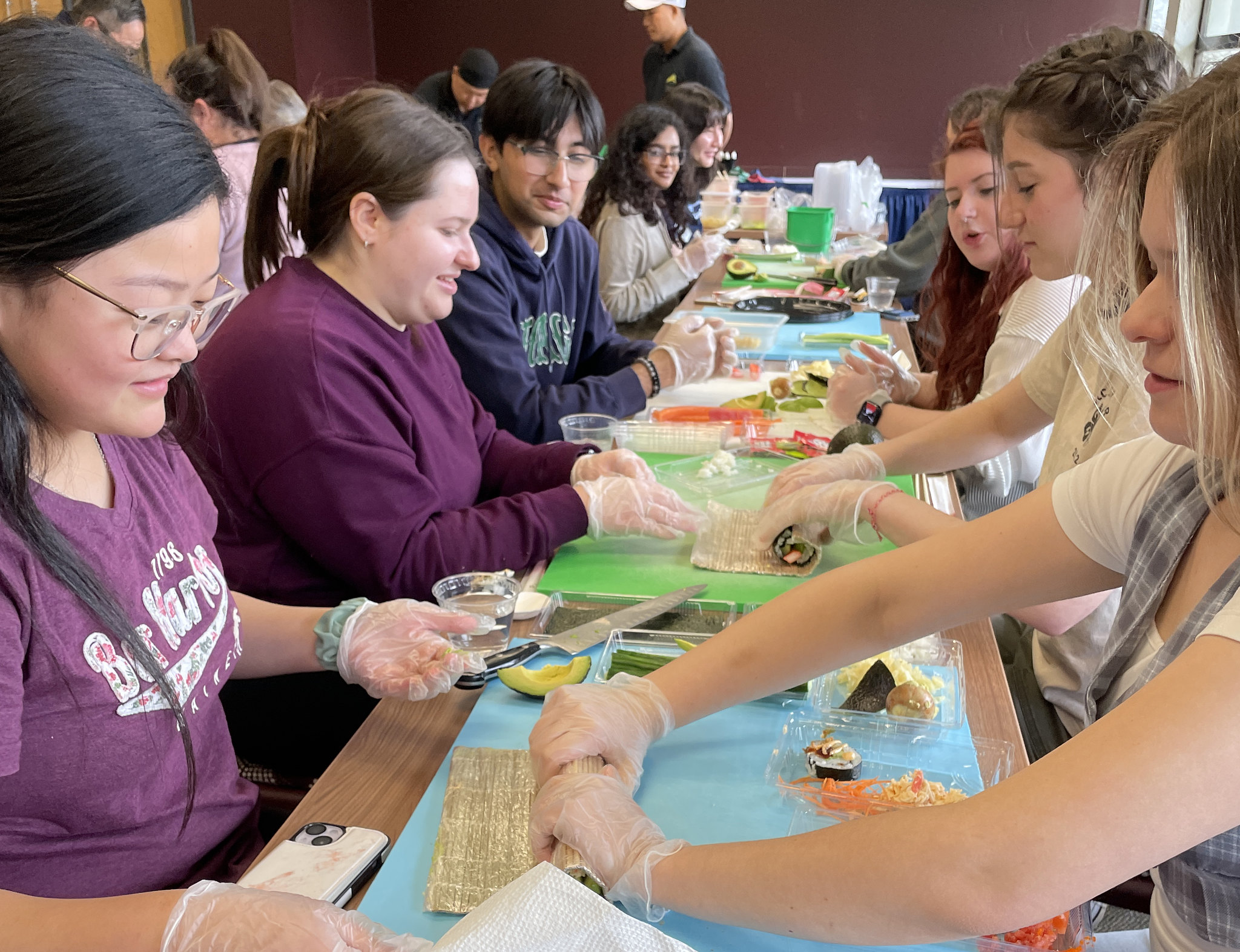 Students learn to roll sushi 