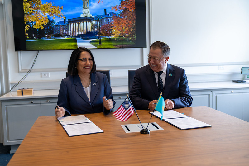 A man and a woman laughing at a table