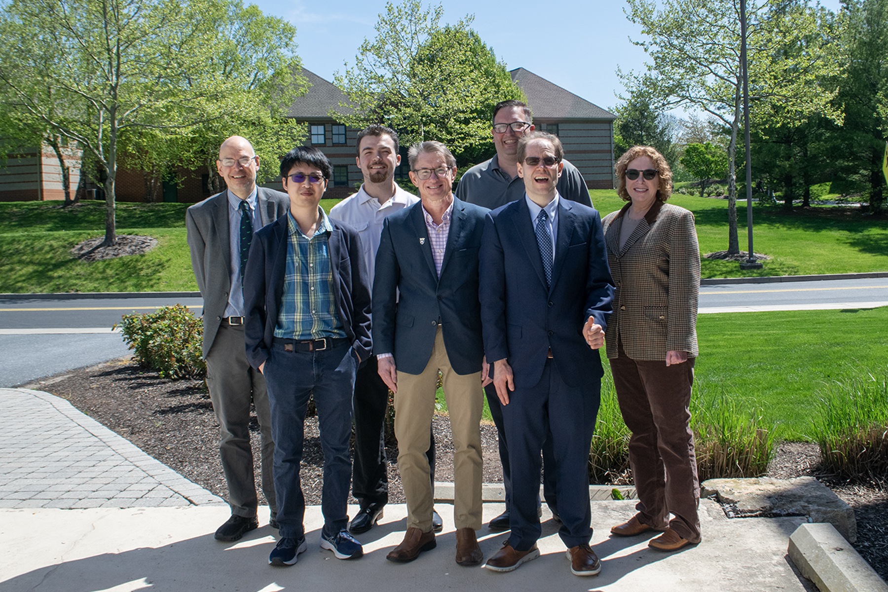 Group photo of Daniel Boustead with Penn State Harrisburg faculty members and recipients of the scholarship Boustead established