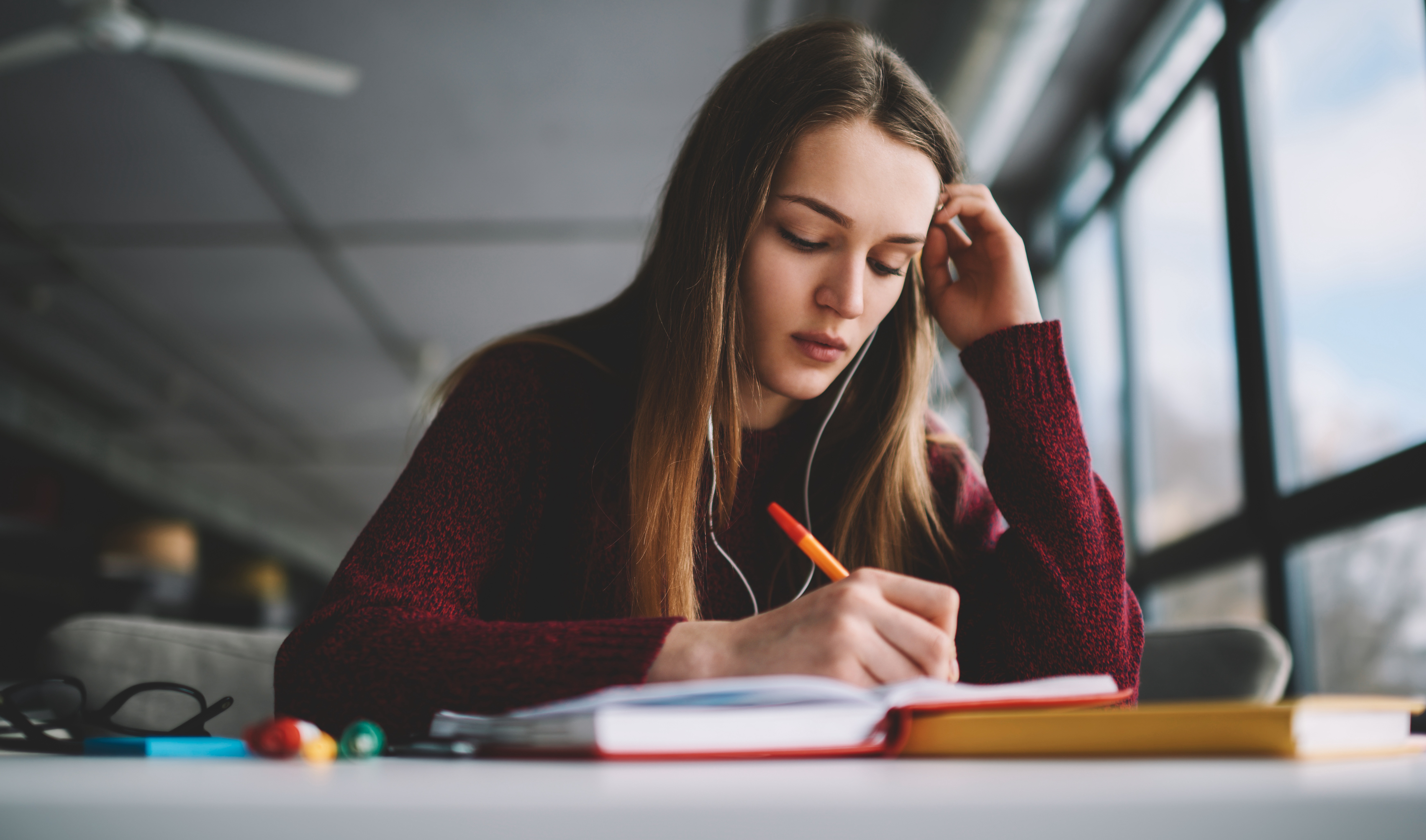 An adolescent girl studying.