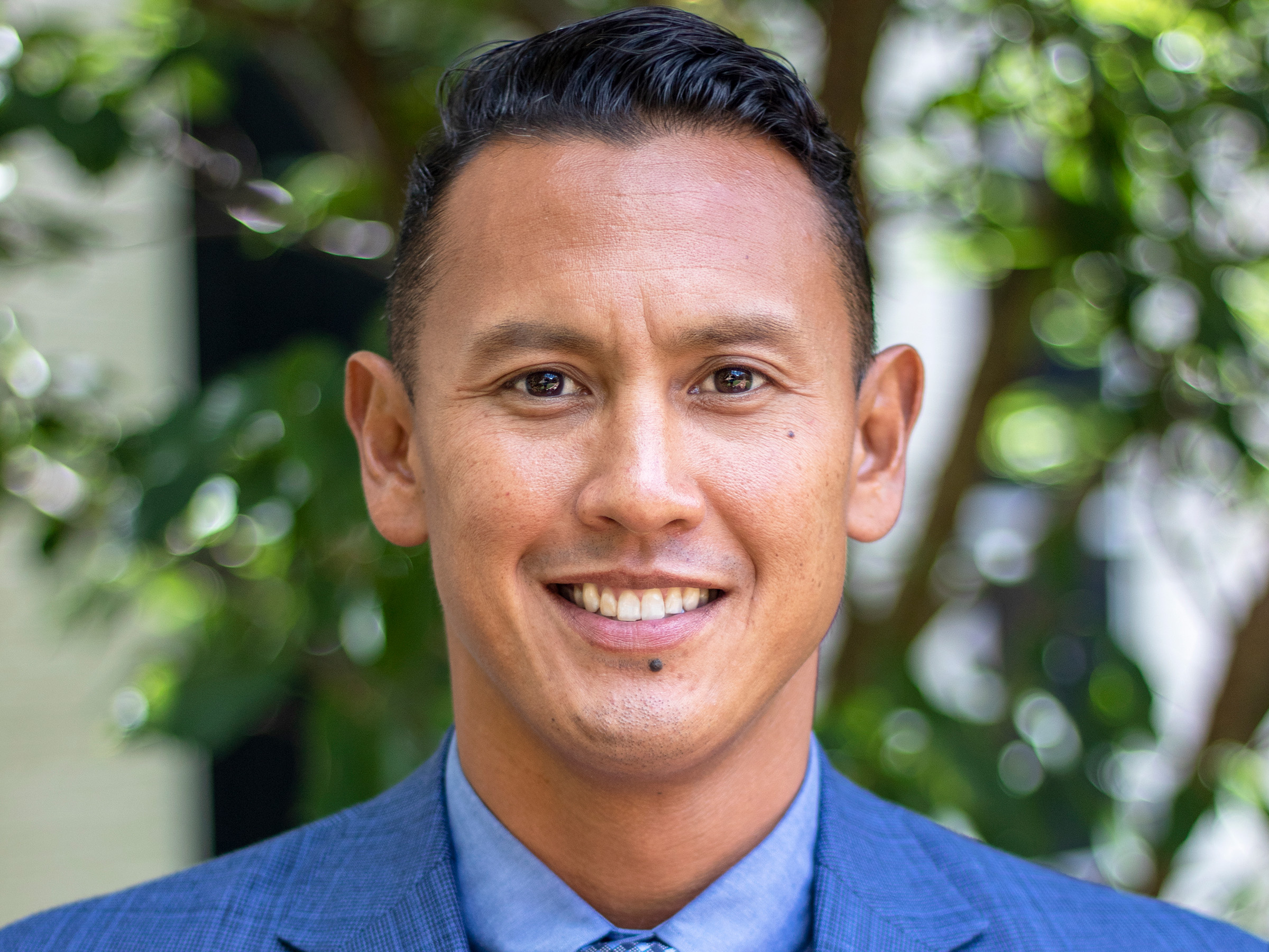 head shot of a smiling Jason godinez