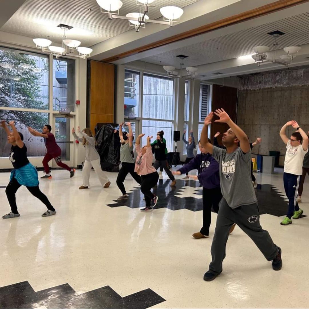 group of students participating in a group activity in a large room at Penn State University Park campus