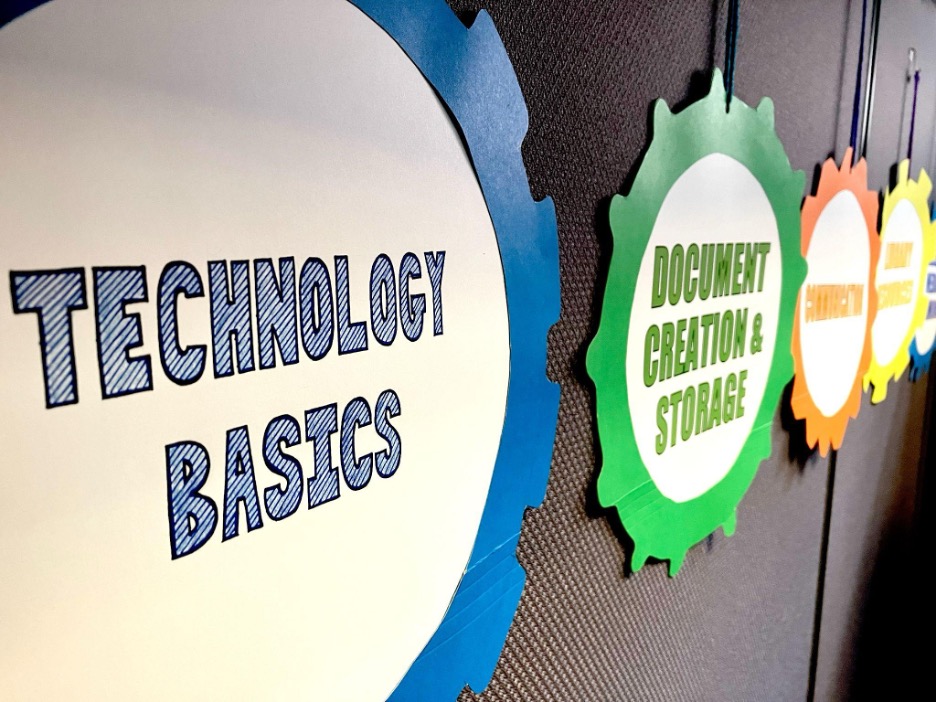 Paper gears displaying technology categories of Technology Basics, Document Creation & Storage, and Communication. 