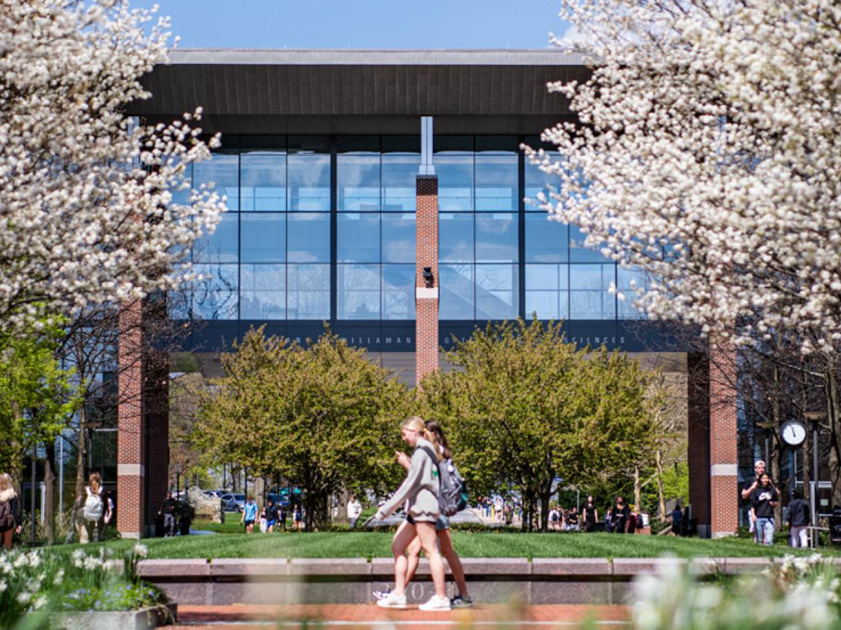 Students walking in front of the Verne M. Willaman Gateway to the Sciences.