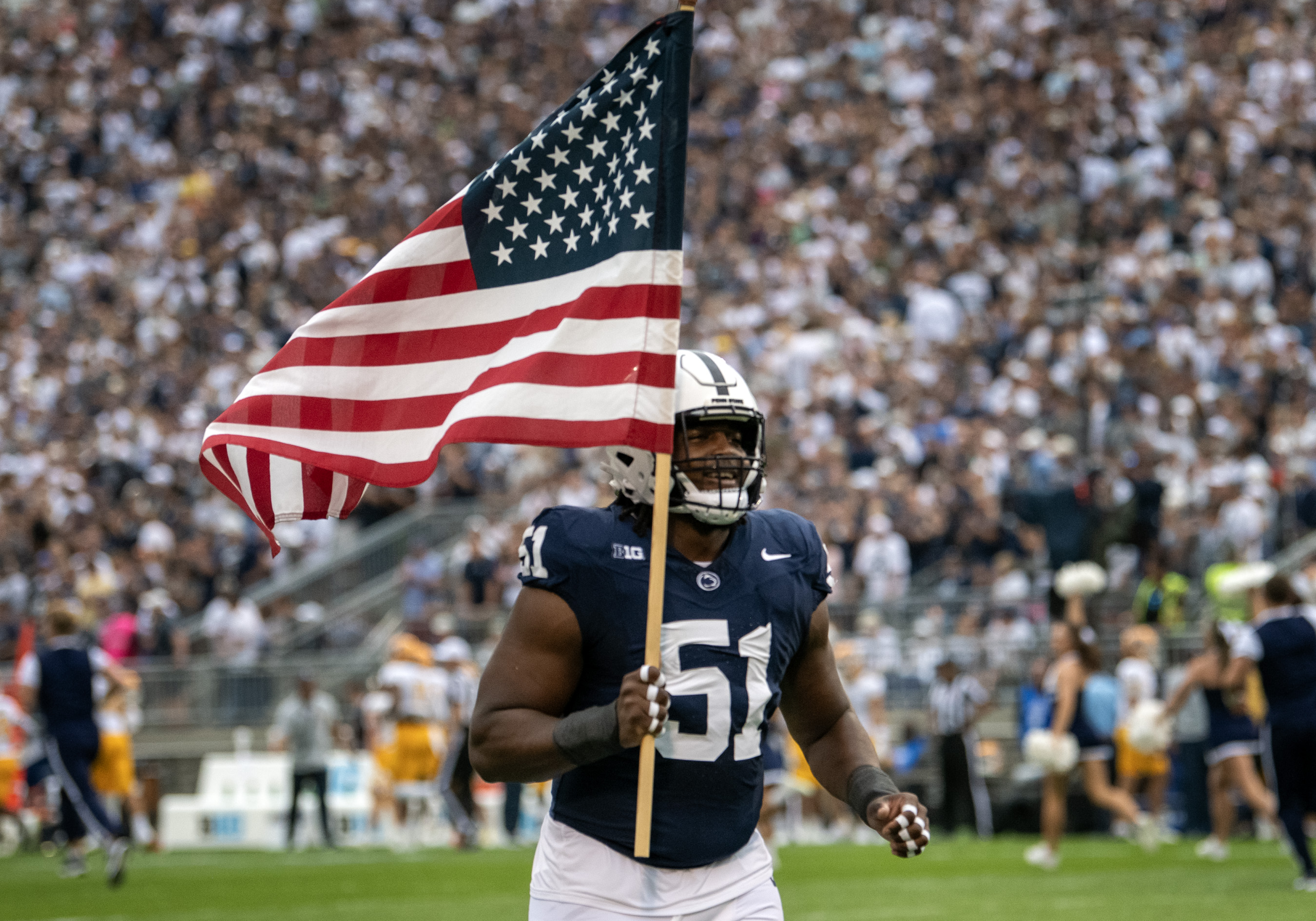 Hakeem Beamon leads team out with American Flag