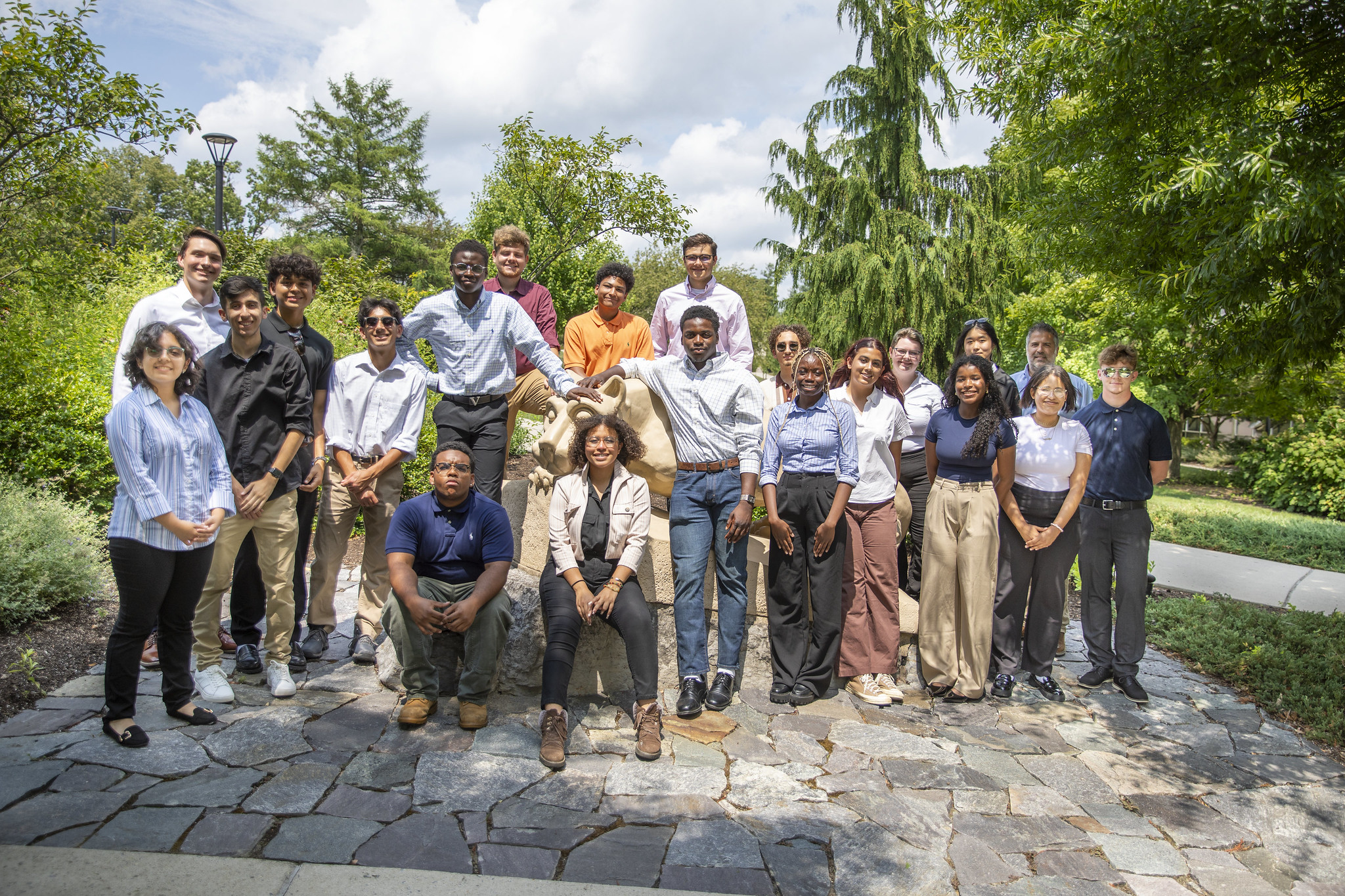 Students in the Engineering Ahead program pose for a photo around the Nittany Lion shrine