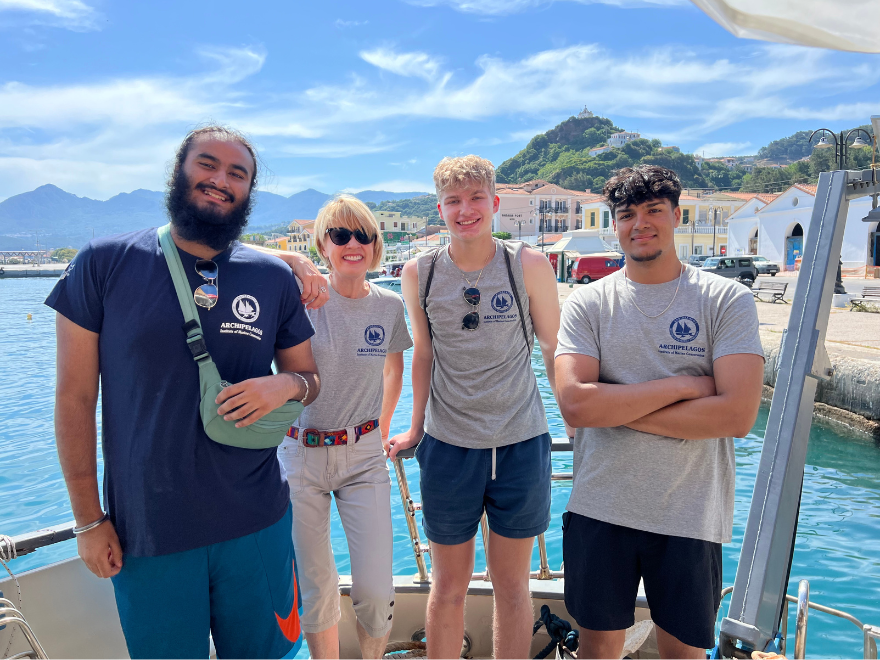 students smile in front of the Agean Sea in Greece 