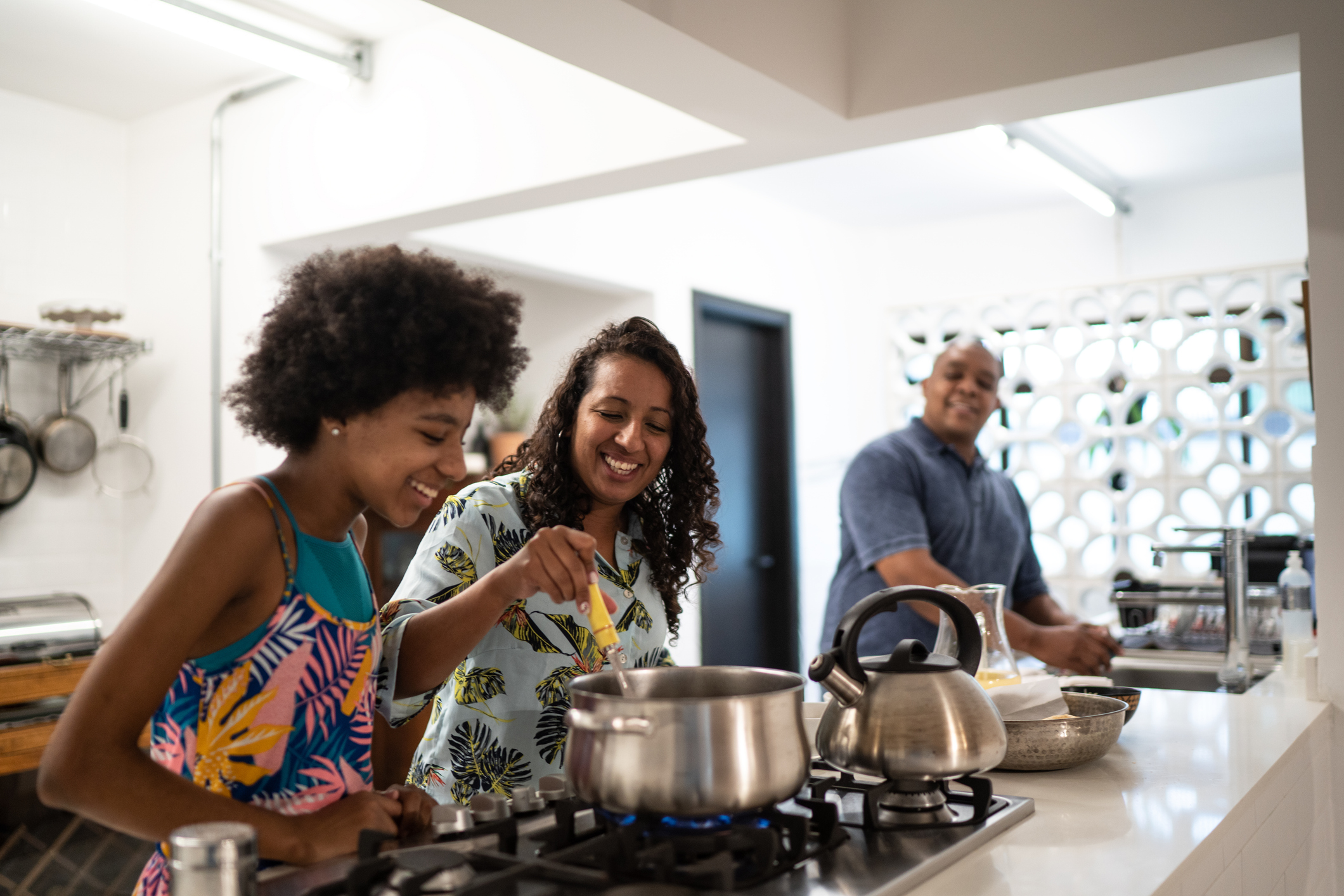 Family cooking together in a large kitchen