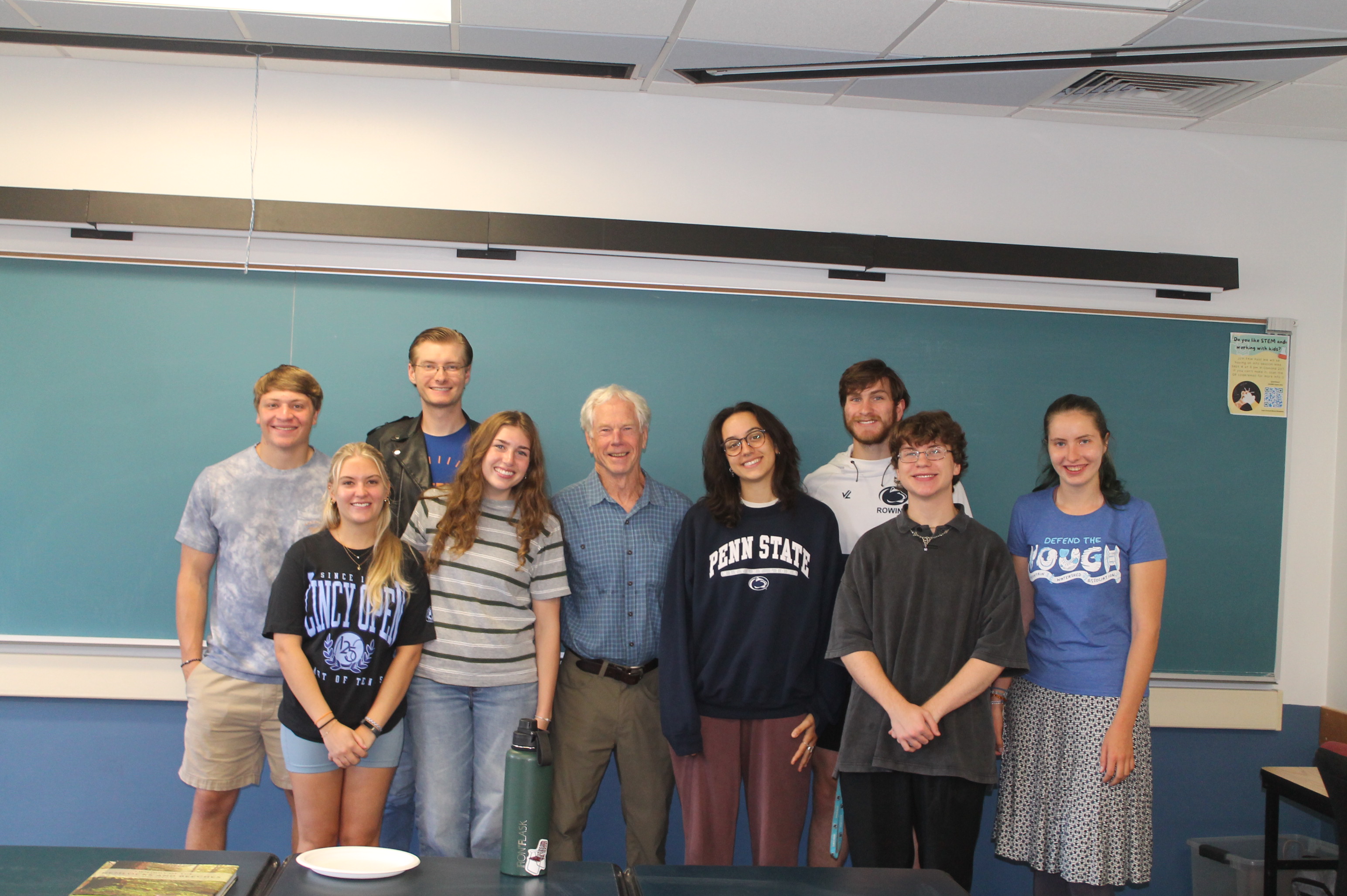 Tim Palmer poses with students during a classroom visit.