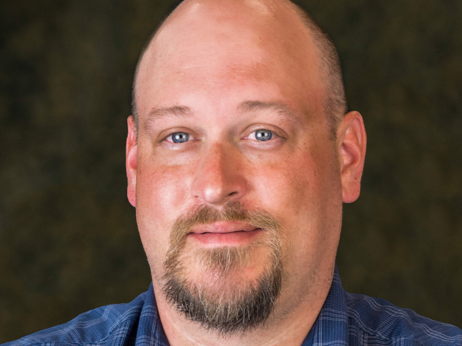 A headshot image of Jason Embick