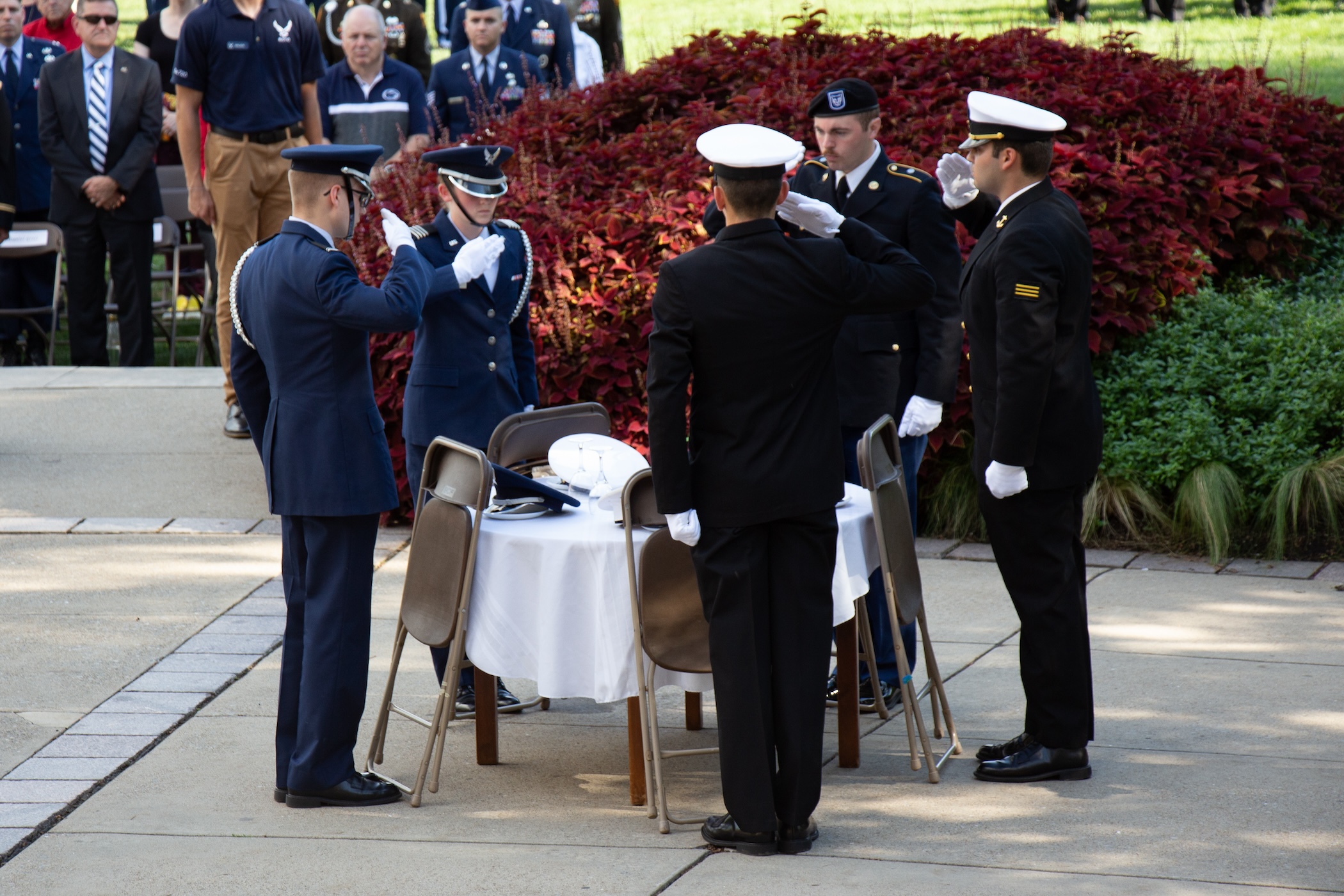 Service members around a missing man table