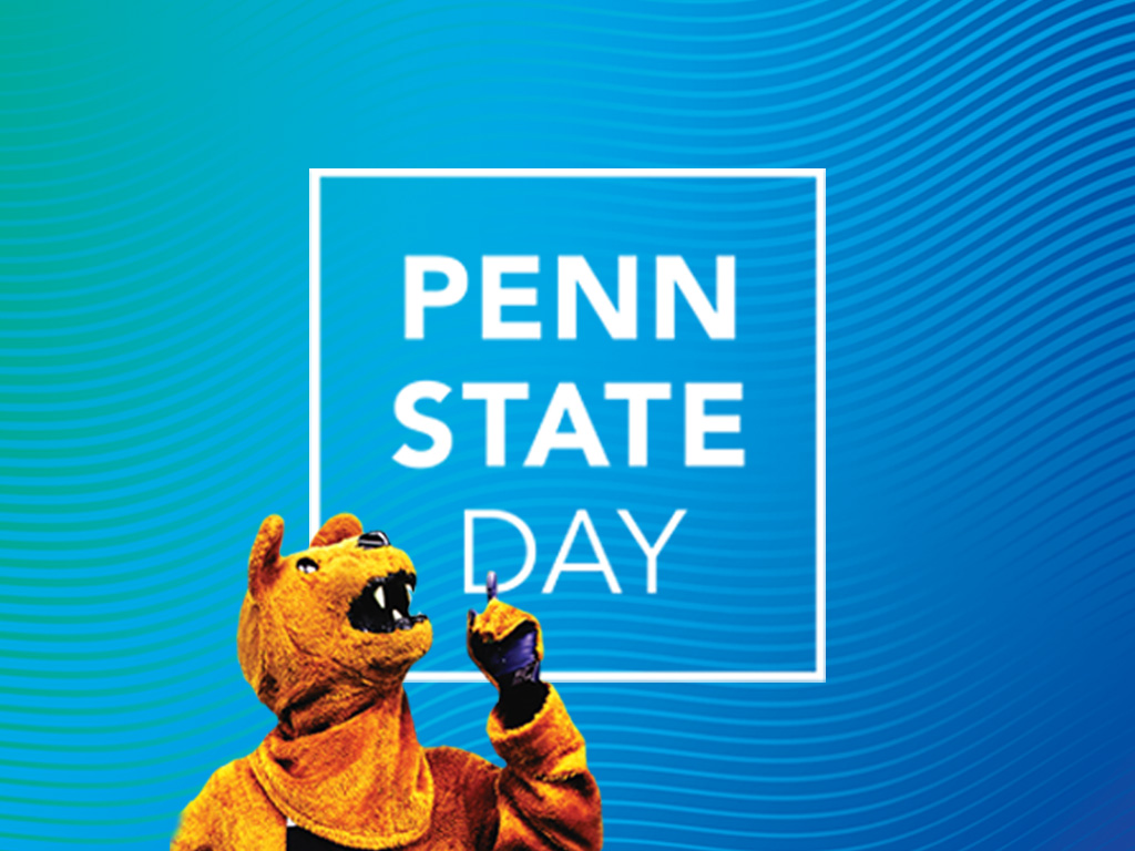 Nittany Lion mascot pointing to text reading "Penn State Day"