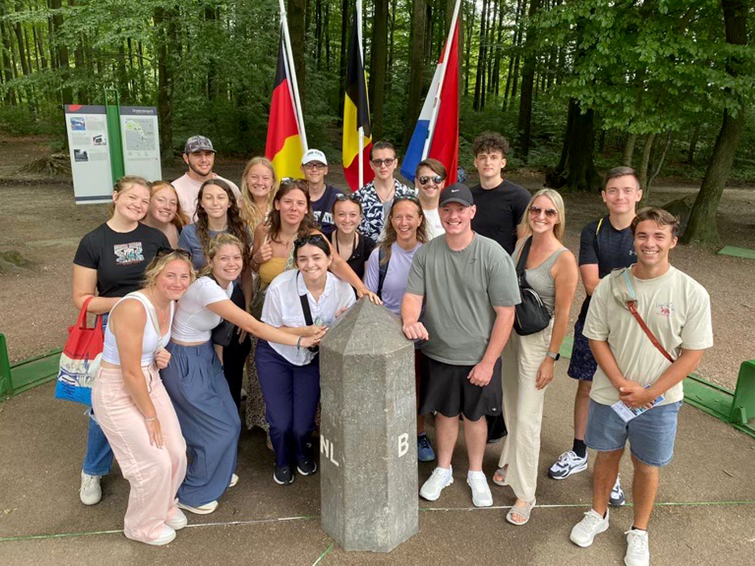 Students and trip advisors from Penn State DuBois gather for a group picture at The Three County Point, where Germany, Belgium, and the Netherlands meet.