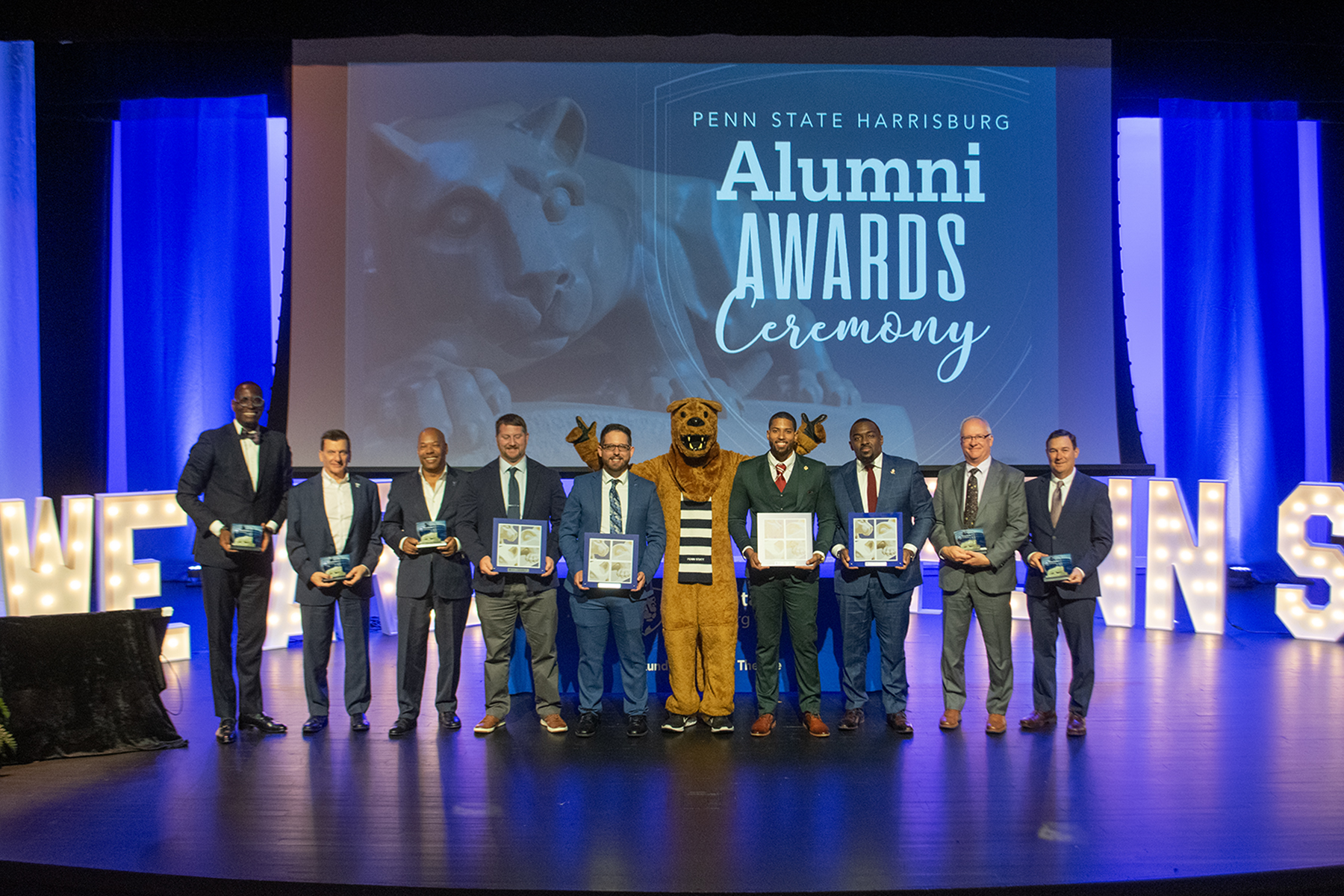 Alumni Award winners gathered onstage in the Kulkarni Theatre