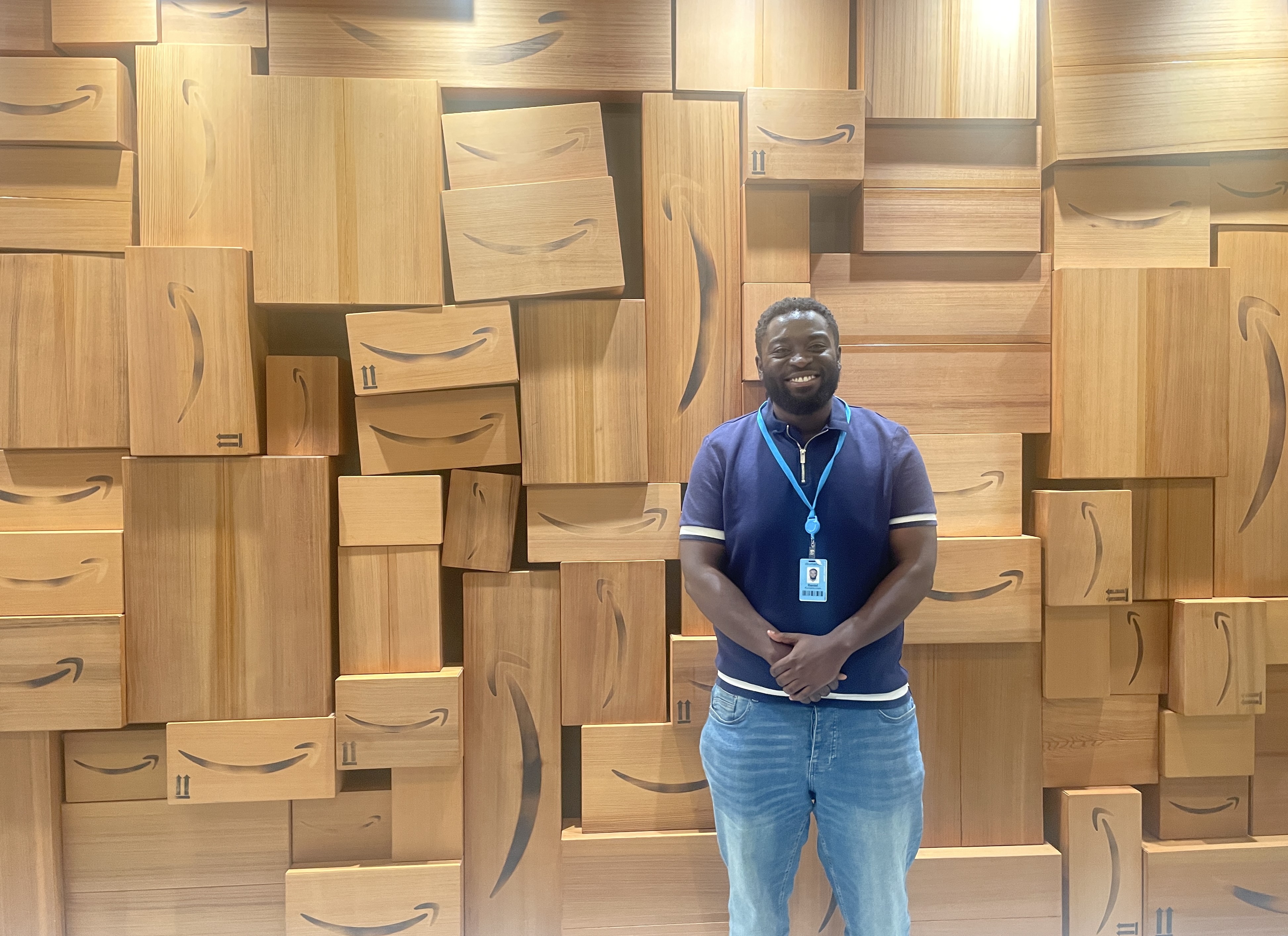 An intern stands in front of a display at Amazon in Seattle  