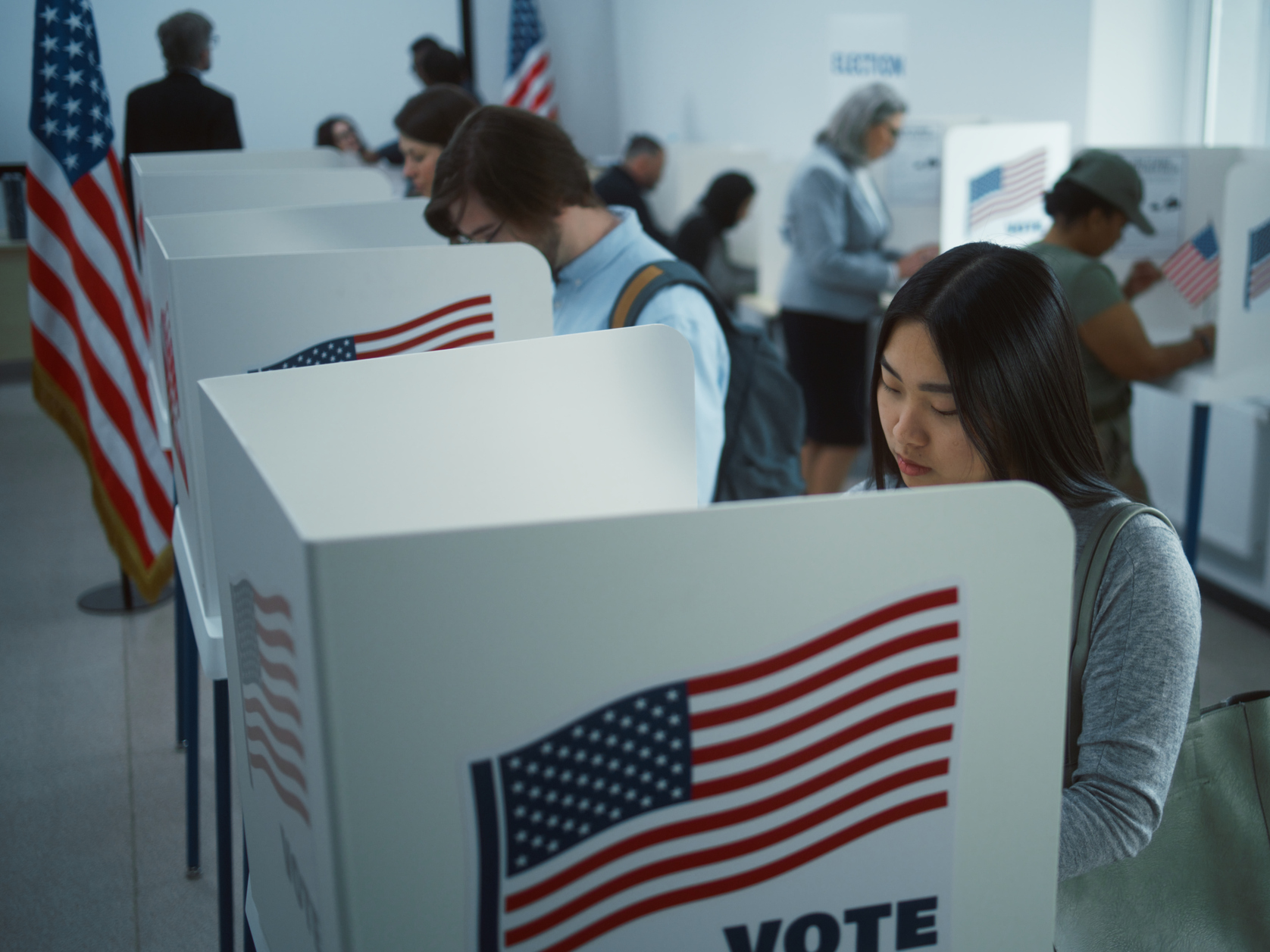 People at voting booths