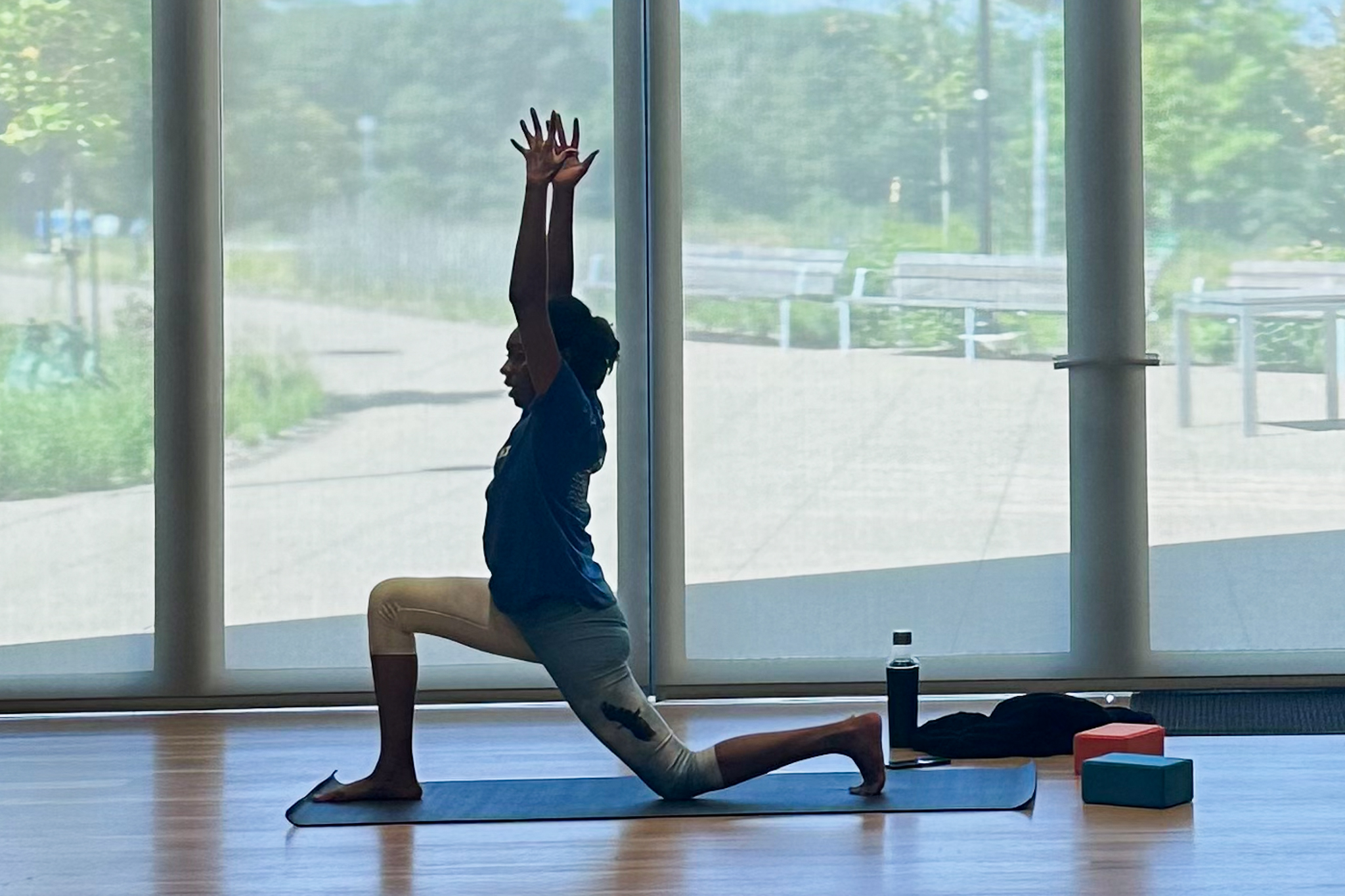 Yoga instructor Latisha Franklin leads a stretch at the Palmer Museum of Art