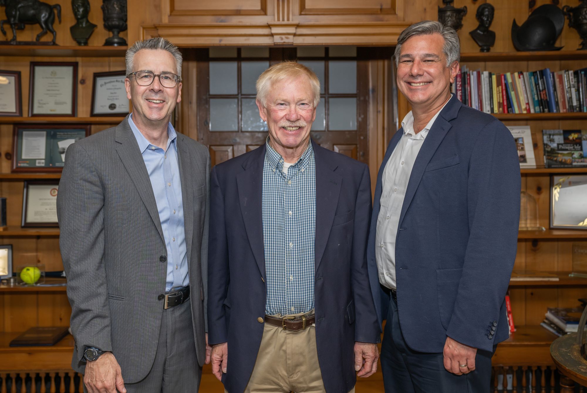 A portrait of Penn State Behrend Chancellor Ralph Ford, college friend Dave Meehl and Tim Kurzweg, the James R. Meehl Director of the School of Engineering.