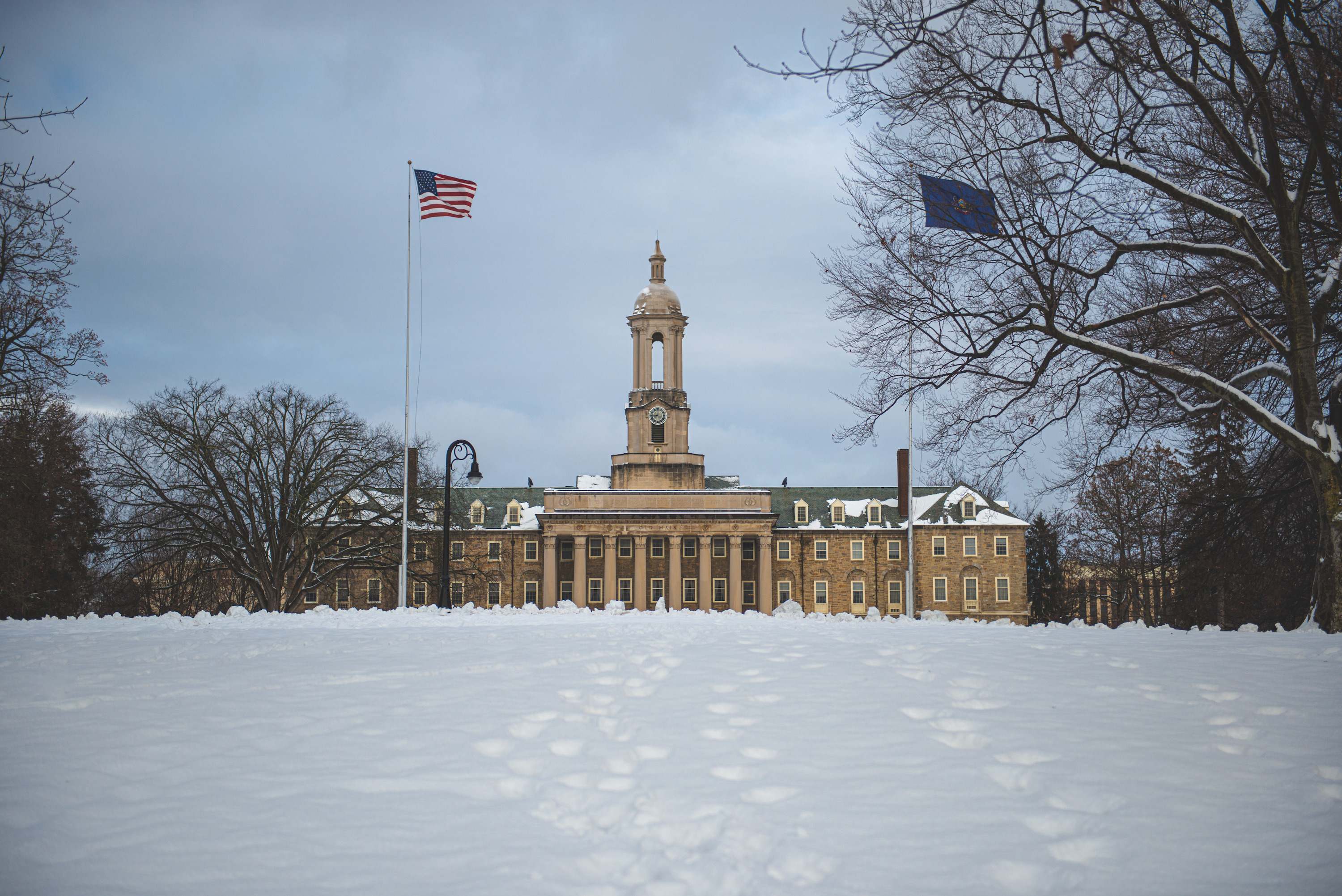 Penn State's Old Main Building with snowy foreground. 