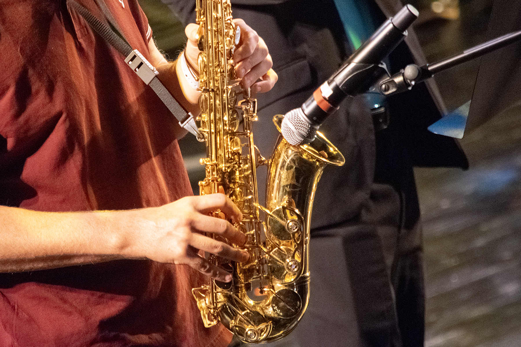 Closeup of a person playing a saxophone