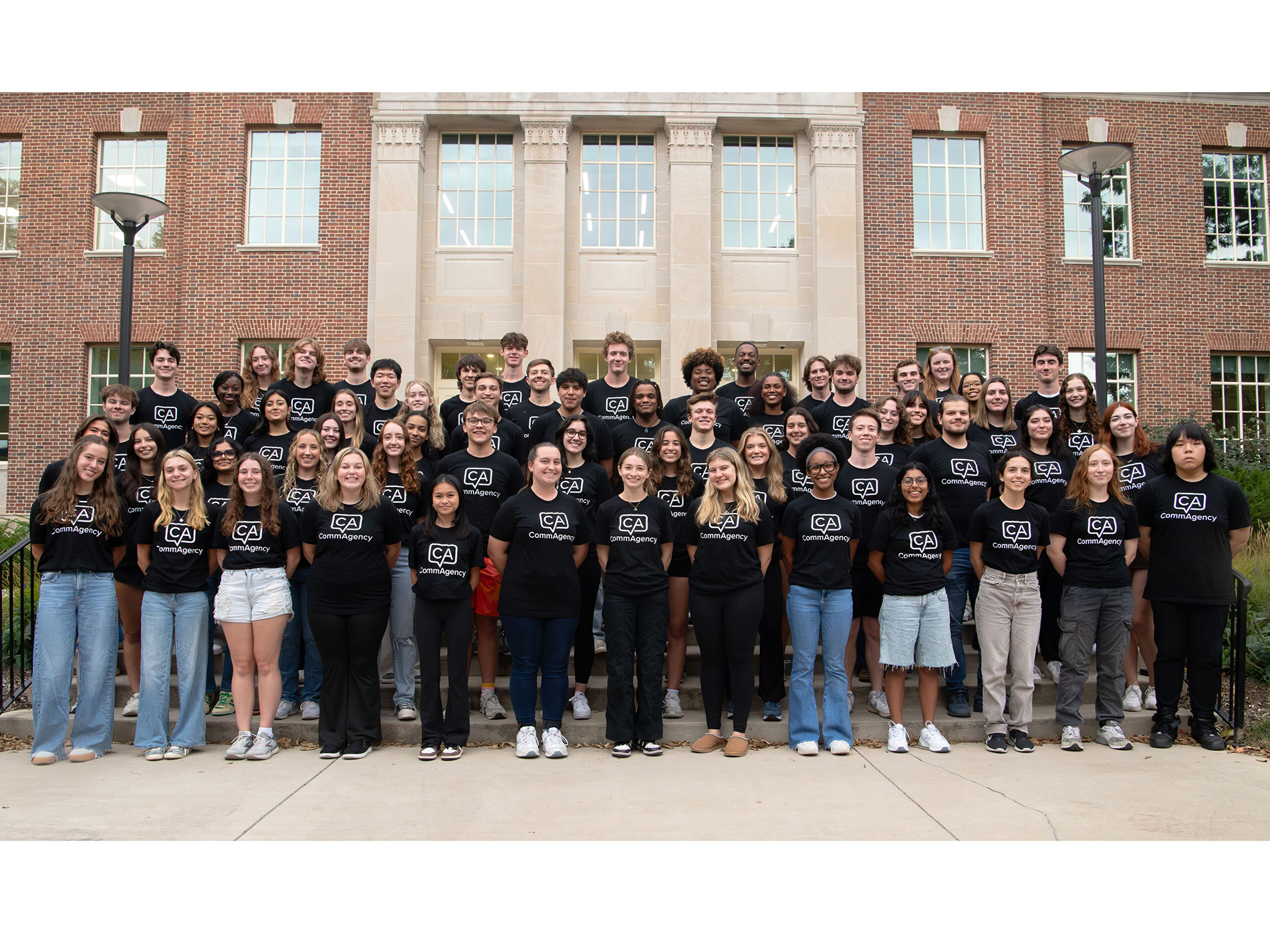 A large group of students pose for a photo