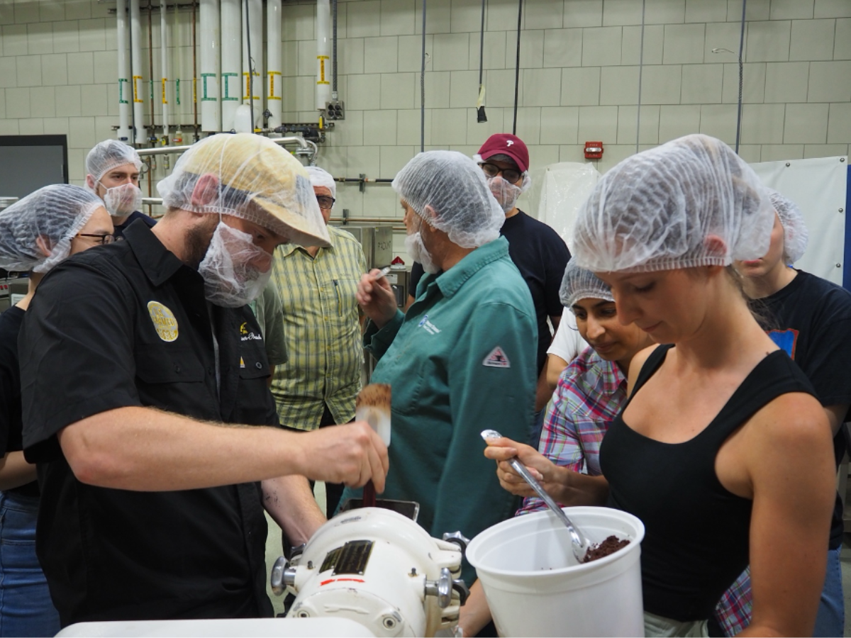 Two camp attendees in hair nets at a workshop