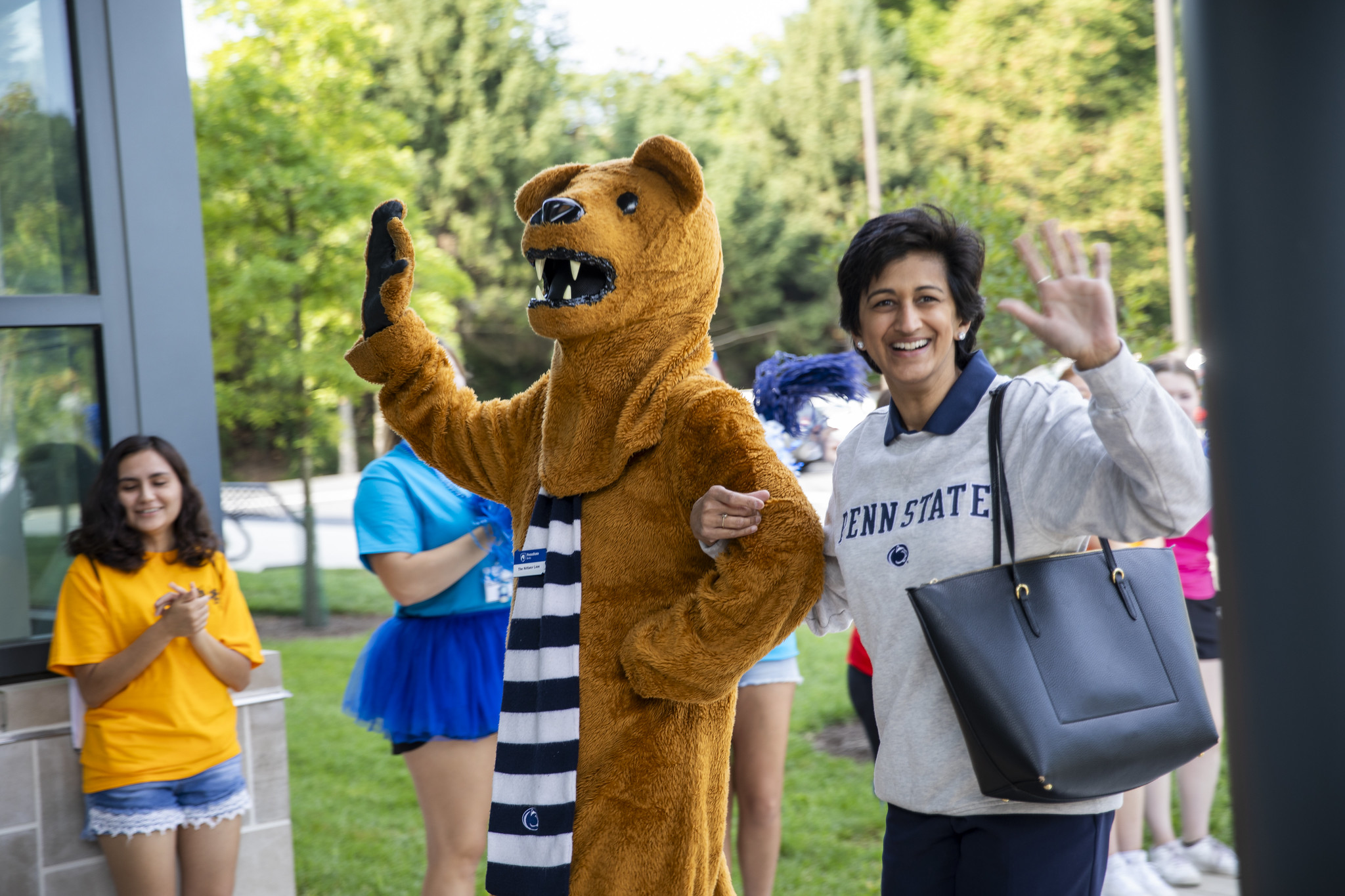 Nittany Lion mascot, left, waves to the crowd with Chancellor Pyati, right